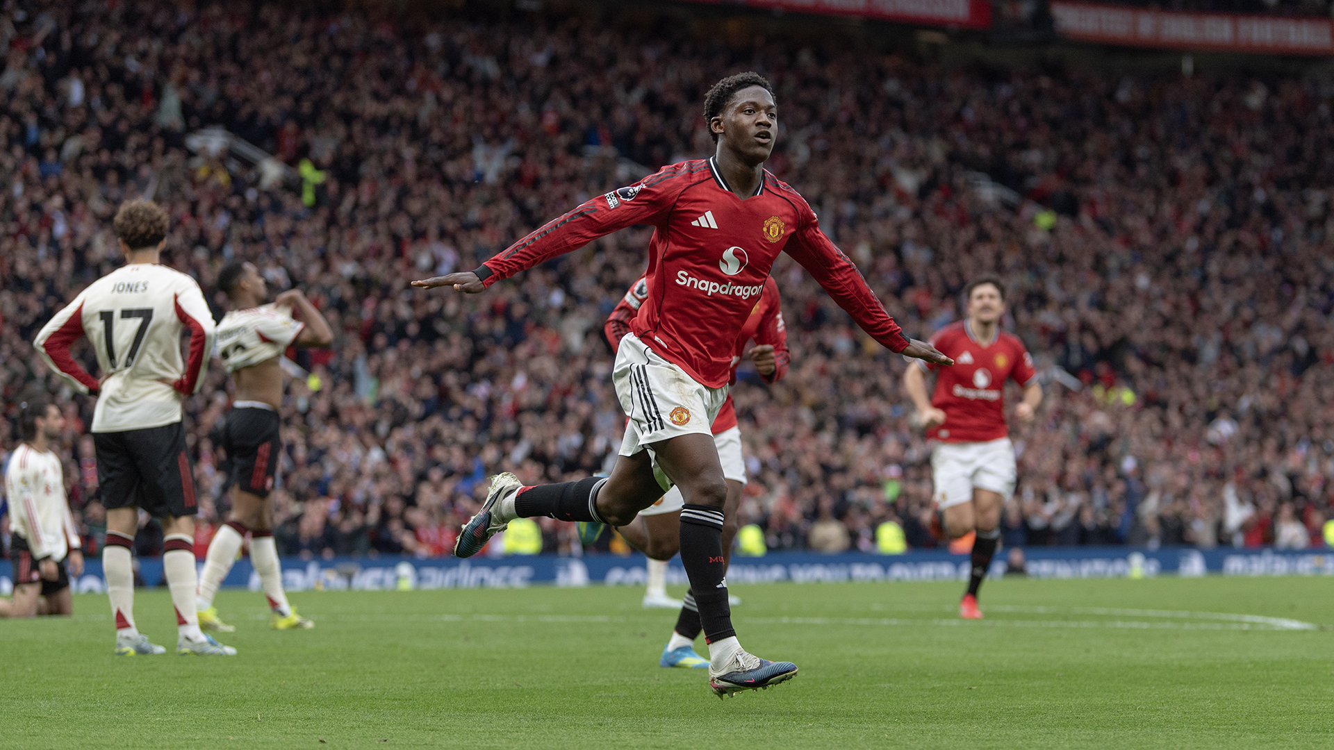 Kobbie Mainoo of Manchester United celebrates scoring the third goal during the Premier League match between Manchester United and Liverpool at Old Trafford on May 3, 2026 in Manchester, England.