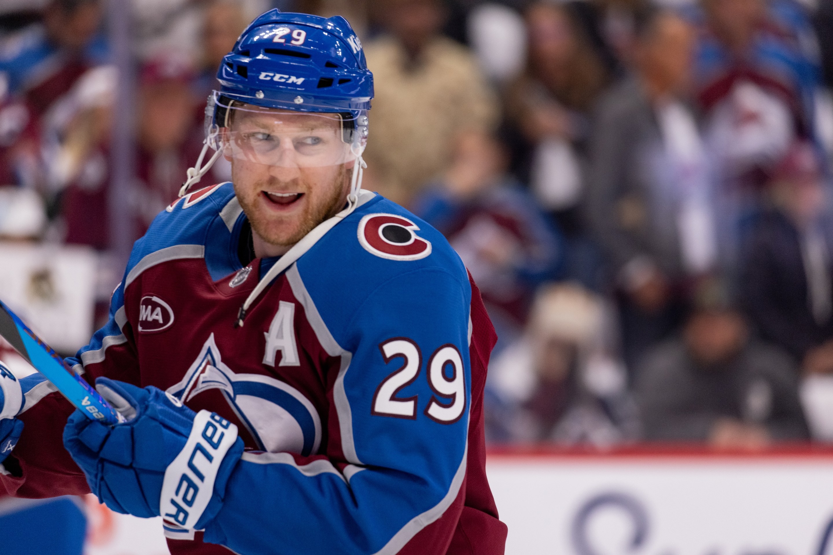 Nathan MacKinnon of the Colorado Avalanche smiles during warmups ahead of Round Two Game Two of the Stanley Cup Playoffs against the Minnesota Wild.