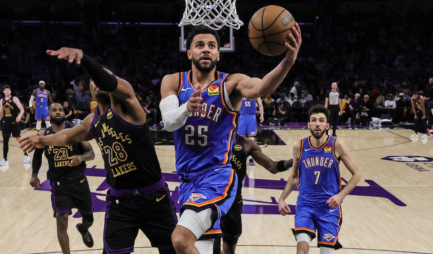 Los Angeles, CA - May 11: Oklahoma City Thunder guard Ajay Mitchell (25) drives past Los Angeles Lakers forward Rui Hachimura (28) in game four of the second round of the NBA playoffs in Los Angeles, CA on Monday, May 11, 2026. (Robert Gauthier/Los Angeles Times via Getty Images)