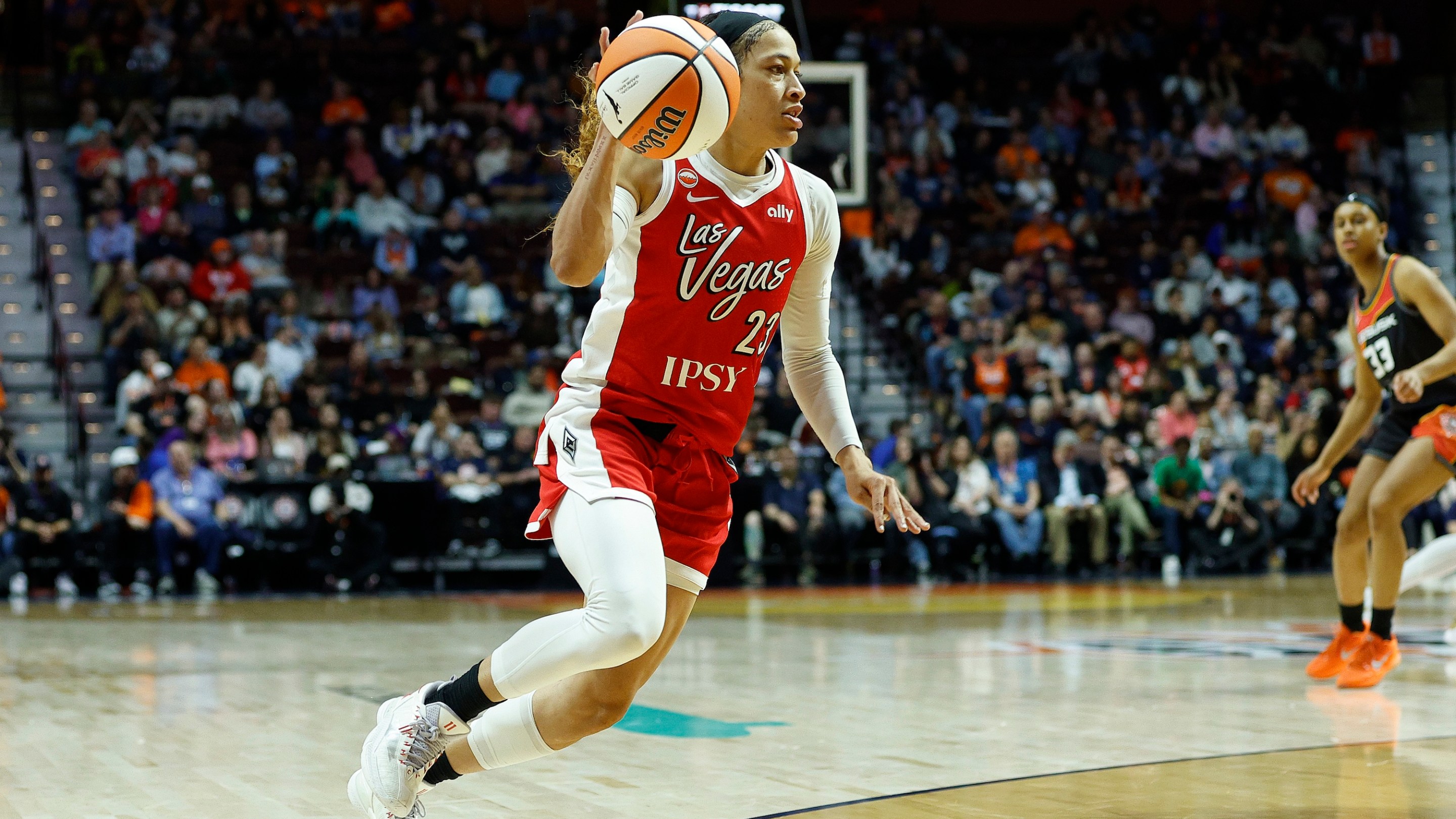Chennedy Carter #23 of the Las Vegas Aces handles the ball during the WNBA game between Las Vegas Aces and Connecticut Sun on May 15, 2026, at Mohegan Sun Arena in Uncasville, CT.