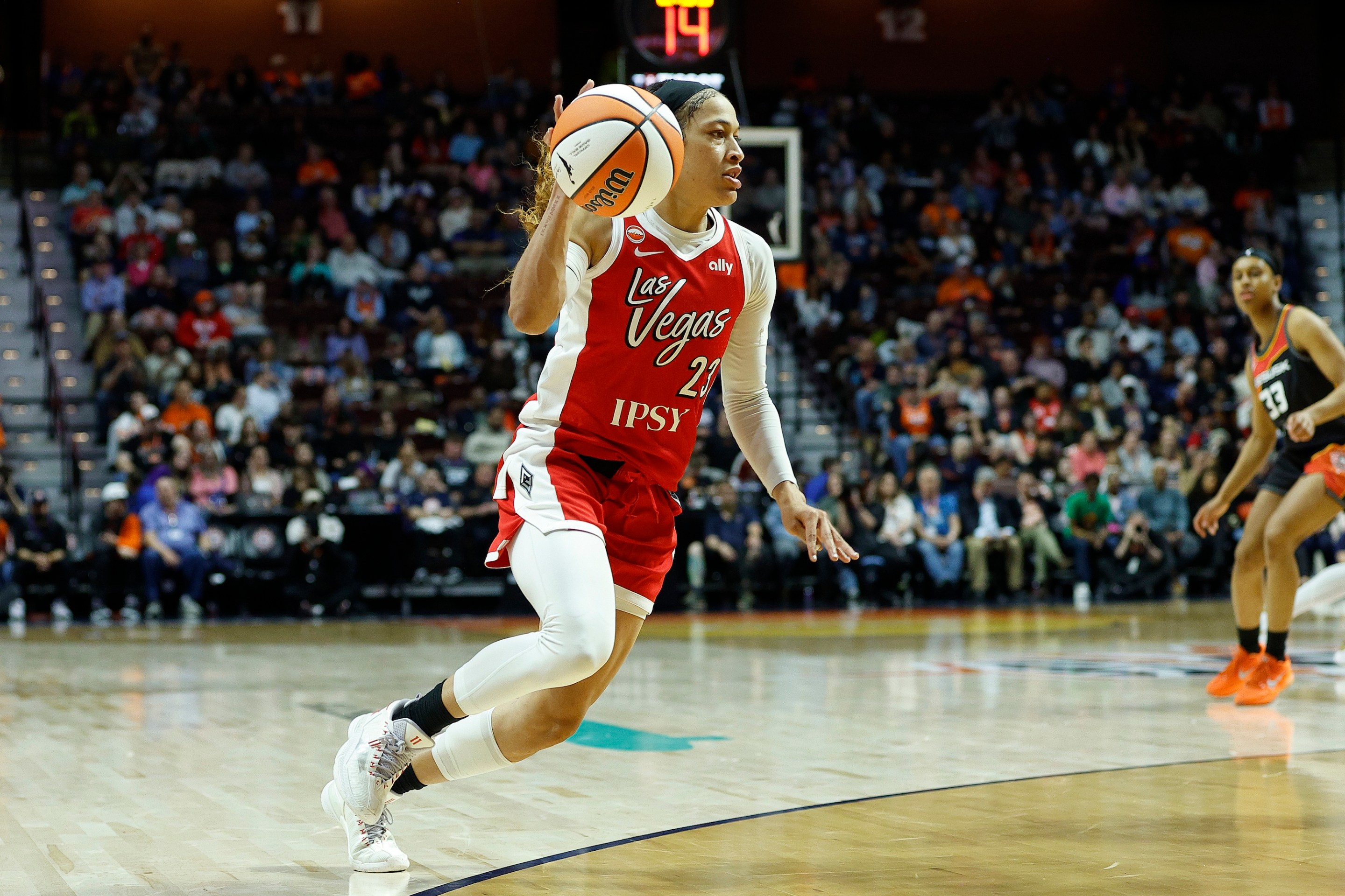 Chennedy Carter #23 of the Las Vegas Aces handles the ball during the WNBA game between Las Vegas Aces and Connecticut Sun on May 15, 2026, at Mohegan Sun Arena in Uncasville, CT.