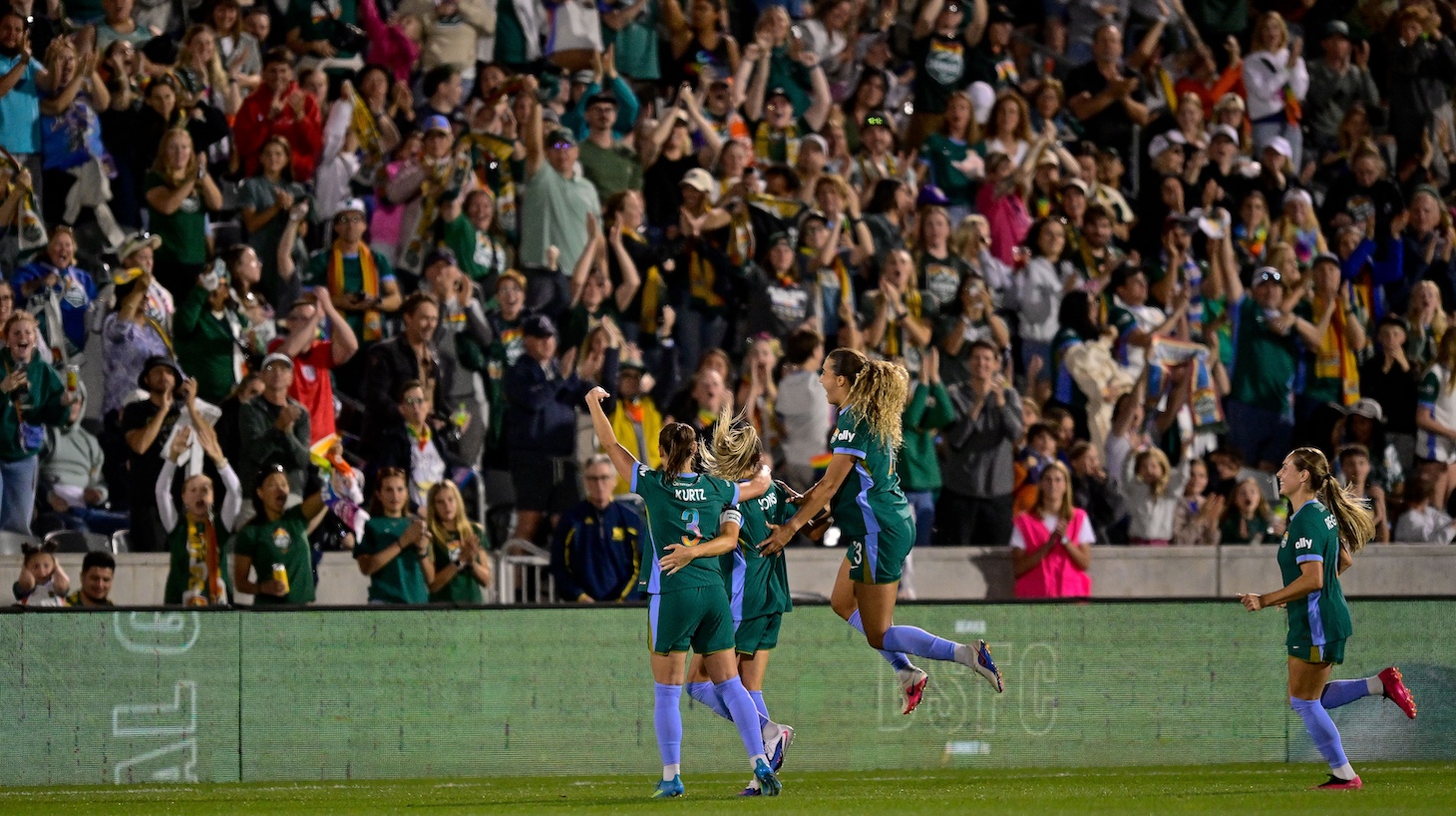 Janine Sonis of the Denver Summit FC celebrateds her second goal of the second half against the Orlando Pride with teammates Kaleigh Kurtz and Eva Gaetino.