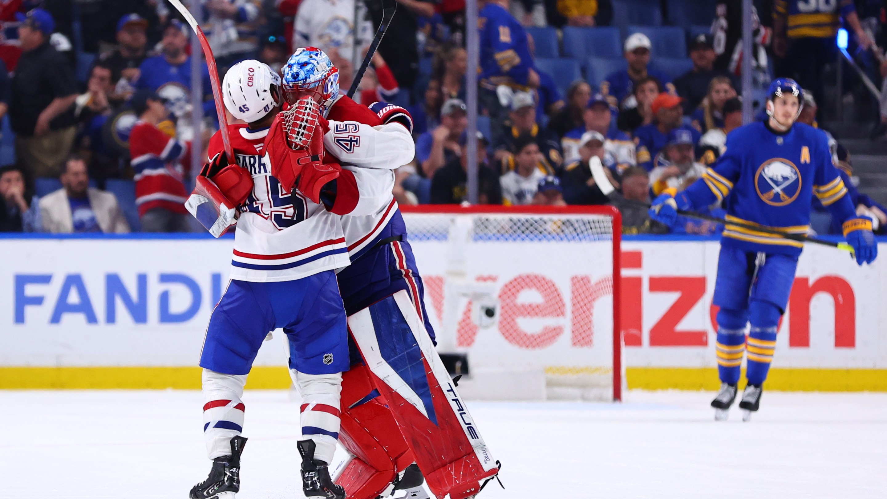 Jakub Dobes #75 of the Montreal Canadiens is congratulated by Alexandre Carrier #45 of the Montreal Canadiens