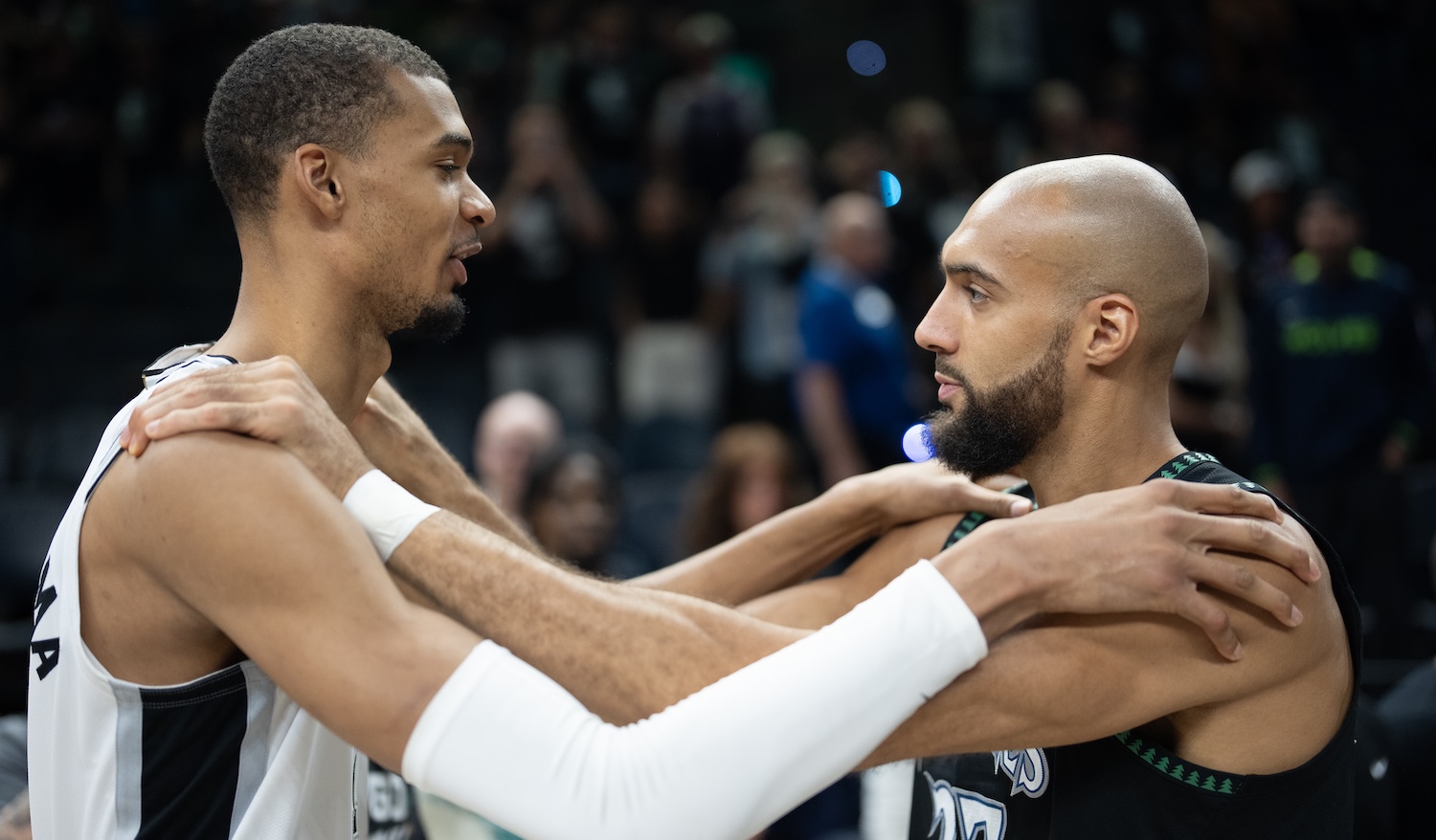 San Antonio Spurs forward Victor Wembanyama (1) and Minnesota Timberwolves center Rudy Gobert (27) embrace after the Spurs defeated the Timberwolves 139-109 in Game 6 of the Western Conference semifinals to clinch the series at Target Center in Minneapolis, Minn. on Friday, May 15, 2026. ]