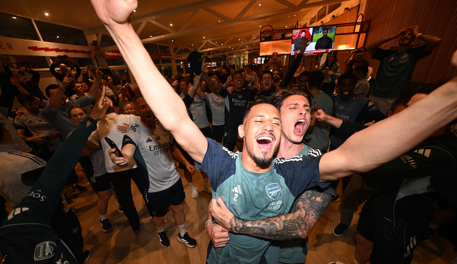 LONDON COLNEY, ENGLAND - MAY 19: (L-R) William Saliba and Riccardo celebrate Arsenal winning the Premier League after watching AFC Bournemouth v Manchester City at Sobha Realty Training Centre on May 19, 2026 in London Colney, England. (Photo by Stuart MacFarlane/Arsenal FC via Getty Images)