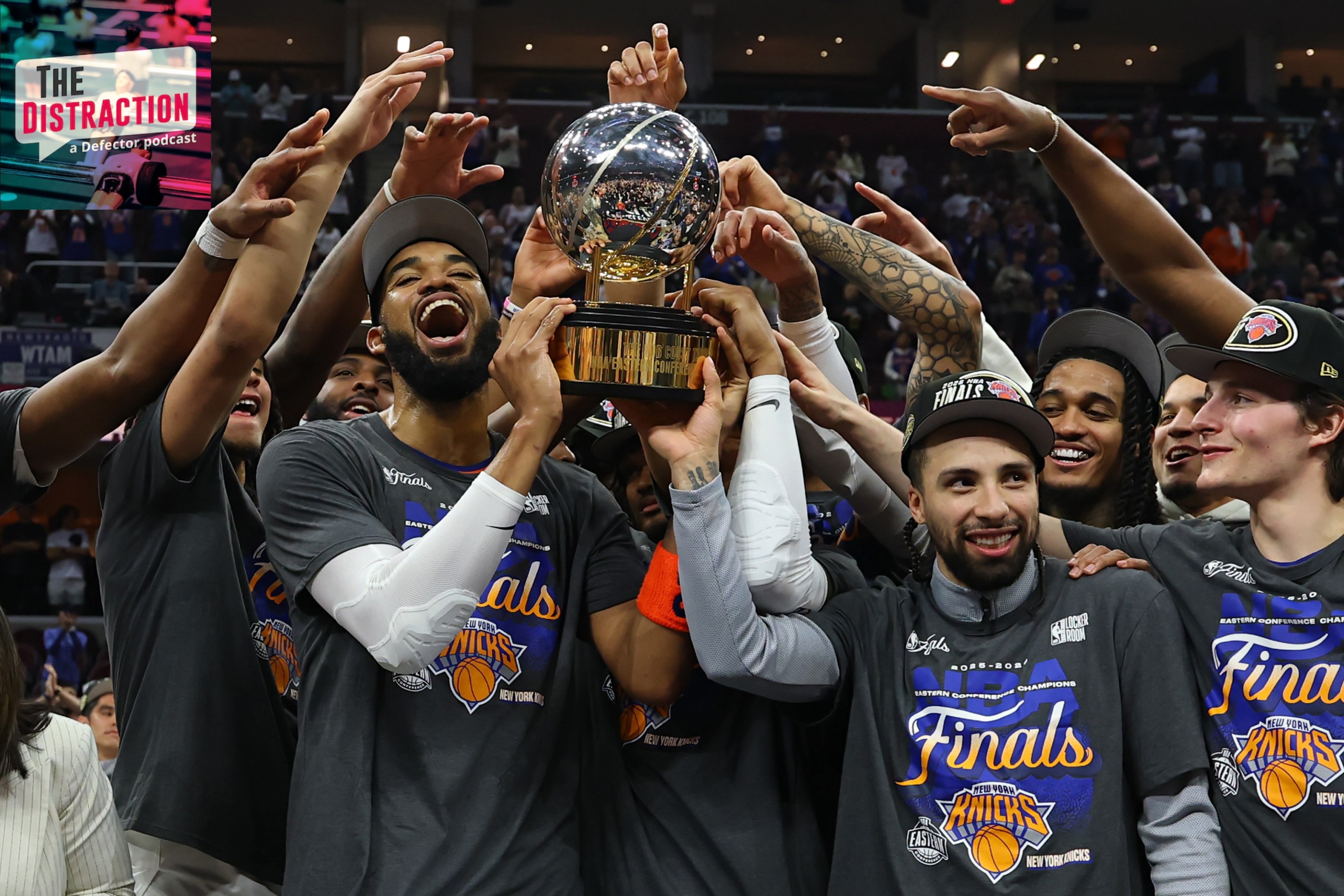 The New York Knicks celebrate with the Bob Cousy Trophy after defeating the Cleveland Cavaliers 130-93 in Game Four of the NBA Eastern Conference Finals at Rocket Arena on May 25, 2026 in Cleveland, Ohio.