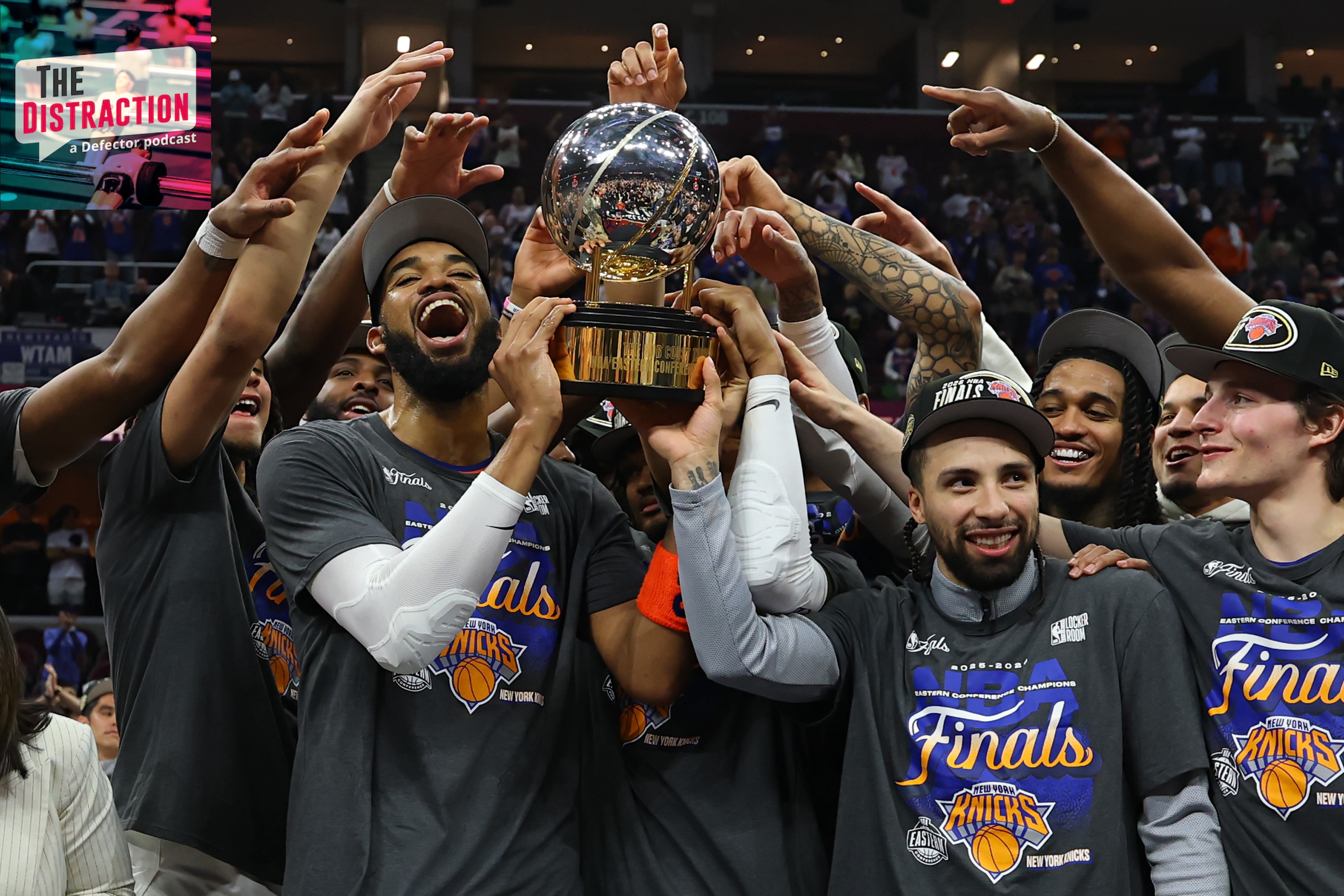 The New York Knicks celebrate with the Bob Cousy Trophy after defeating the Cleveland Cavaliers 130-93 in Game Four of the NBA Eastern Conference Finals at Rocket Arena on May 25, 2026 in Cleveland, Ohio.