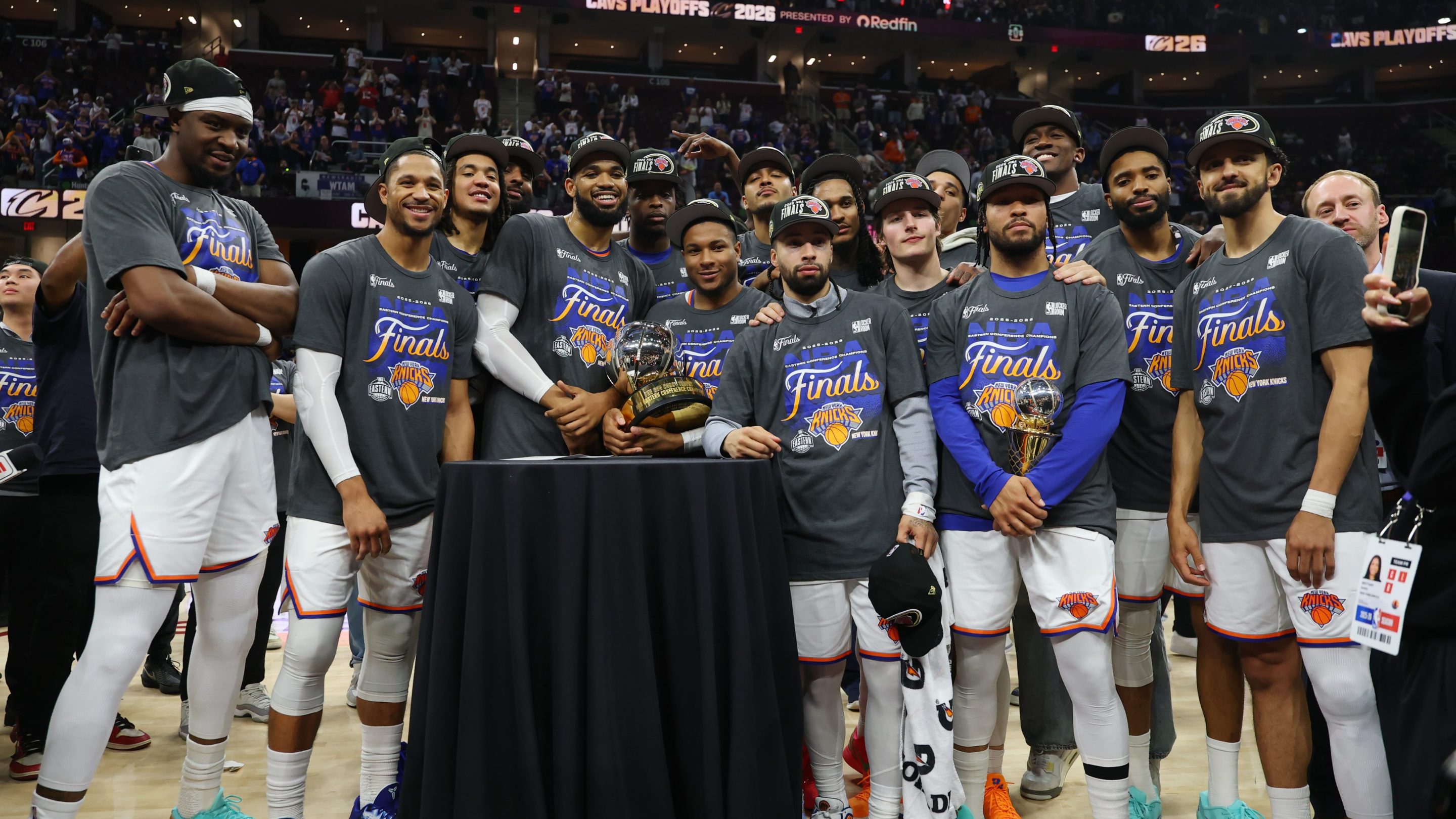The New York Knicks celebrate with the Bob Cousy Trophy after defeating the Cleveland Cavaliers 130-93 in Game Four of the NBA Eastern Conference Finals