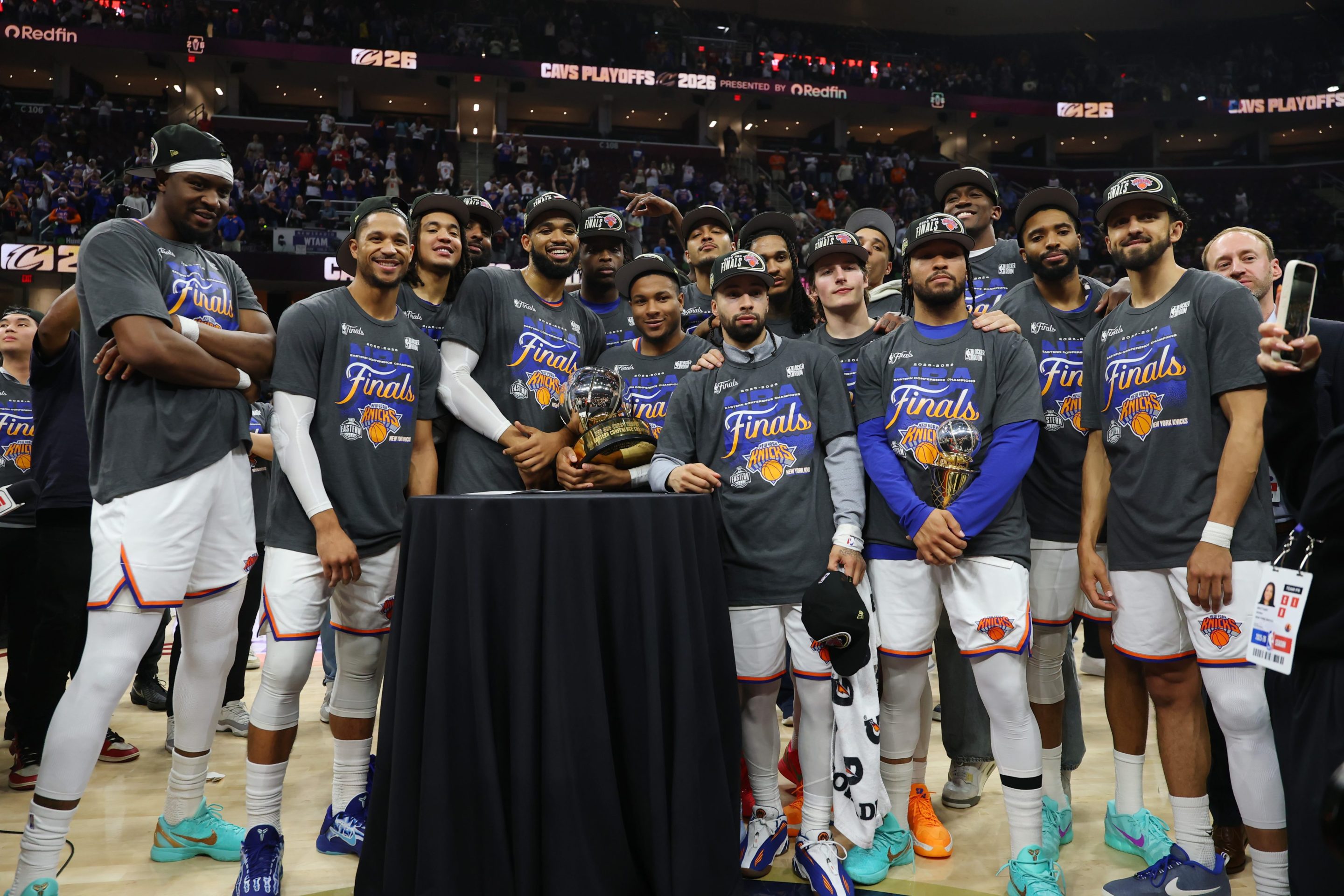 The New York Knicks celebrate with the Bob Cousy Trophy after defeating the Cleveland Cavaliers 130-93 in Game Four of the NBA Eastern Conference Finals