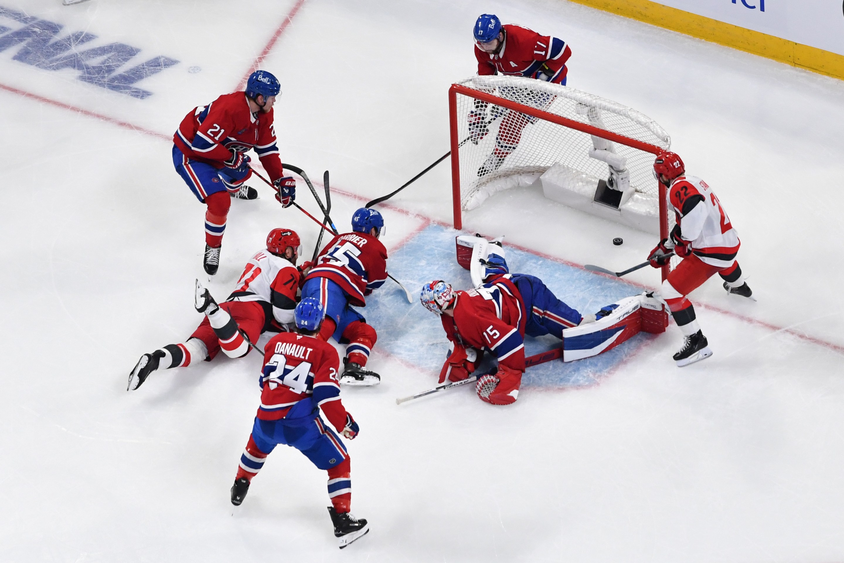Taylor Hall #71 of the Carolina Hurricanes scores a goal past Jakub Dobes