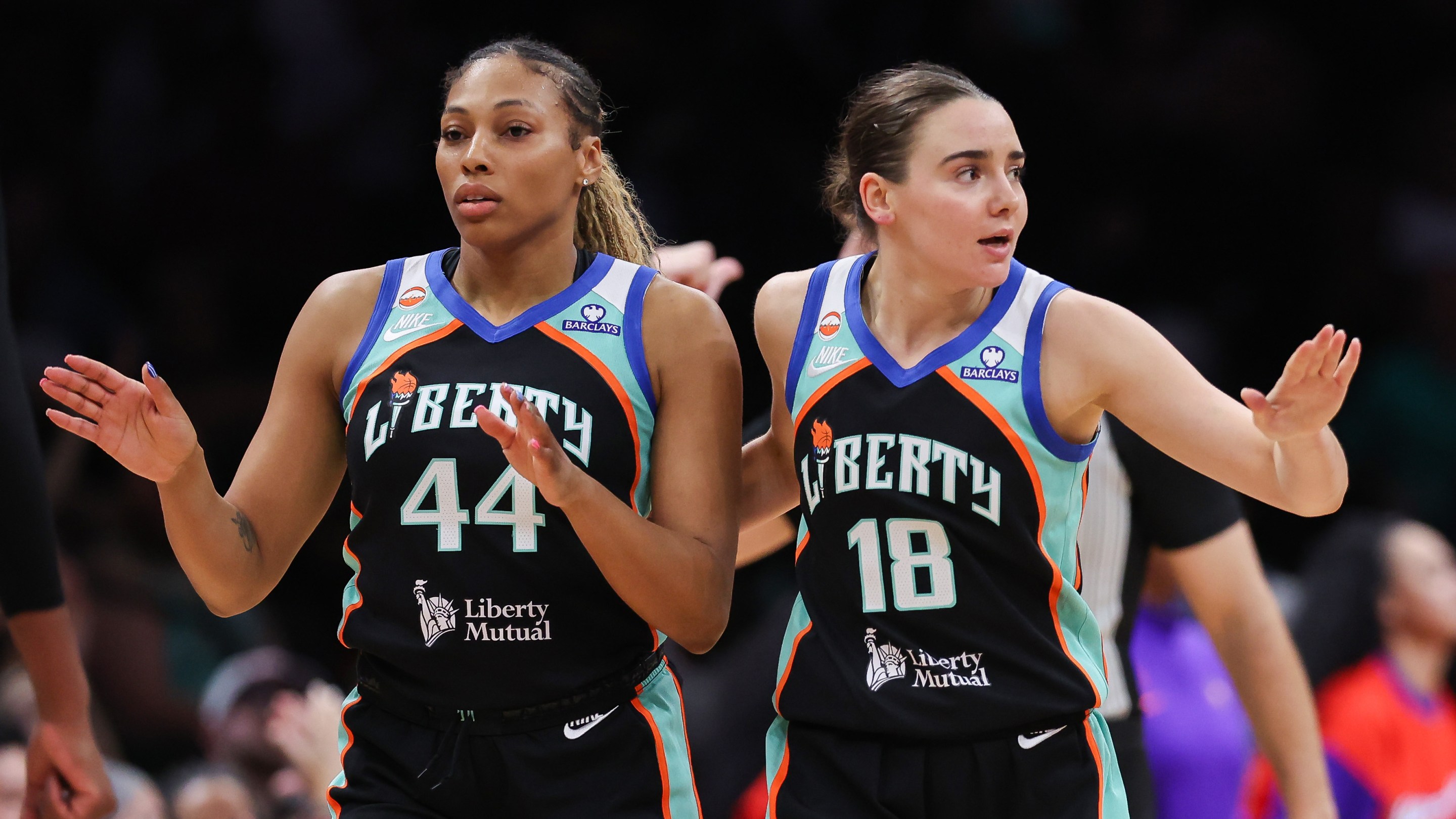 Betnijah Laney-Hamilton #44 and Pauline Astier #18 of the New York Liberty celebrate after a timeout during the fourth quarter against the Phoenix Mercury at Barclays Center on May 27, 2026 in the Brooklyn borough of New York City.