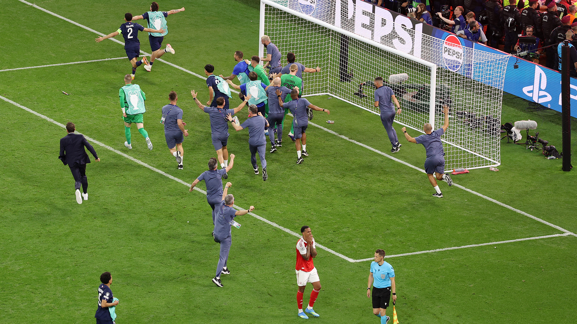 Gabriel of Arsenal looks dejected after missing the team's fifth penalty in the penalty shoot out, as players of Paris Saint-Germain celebrate victory in the UEFA Champions League Final 2026 match between Paris Saint-Germain and Arsenal FC at Puskas Arena on May 30, 2026 in Budapest, Hungary.