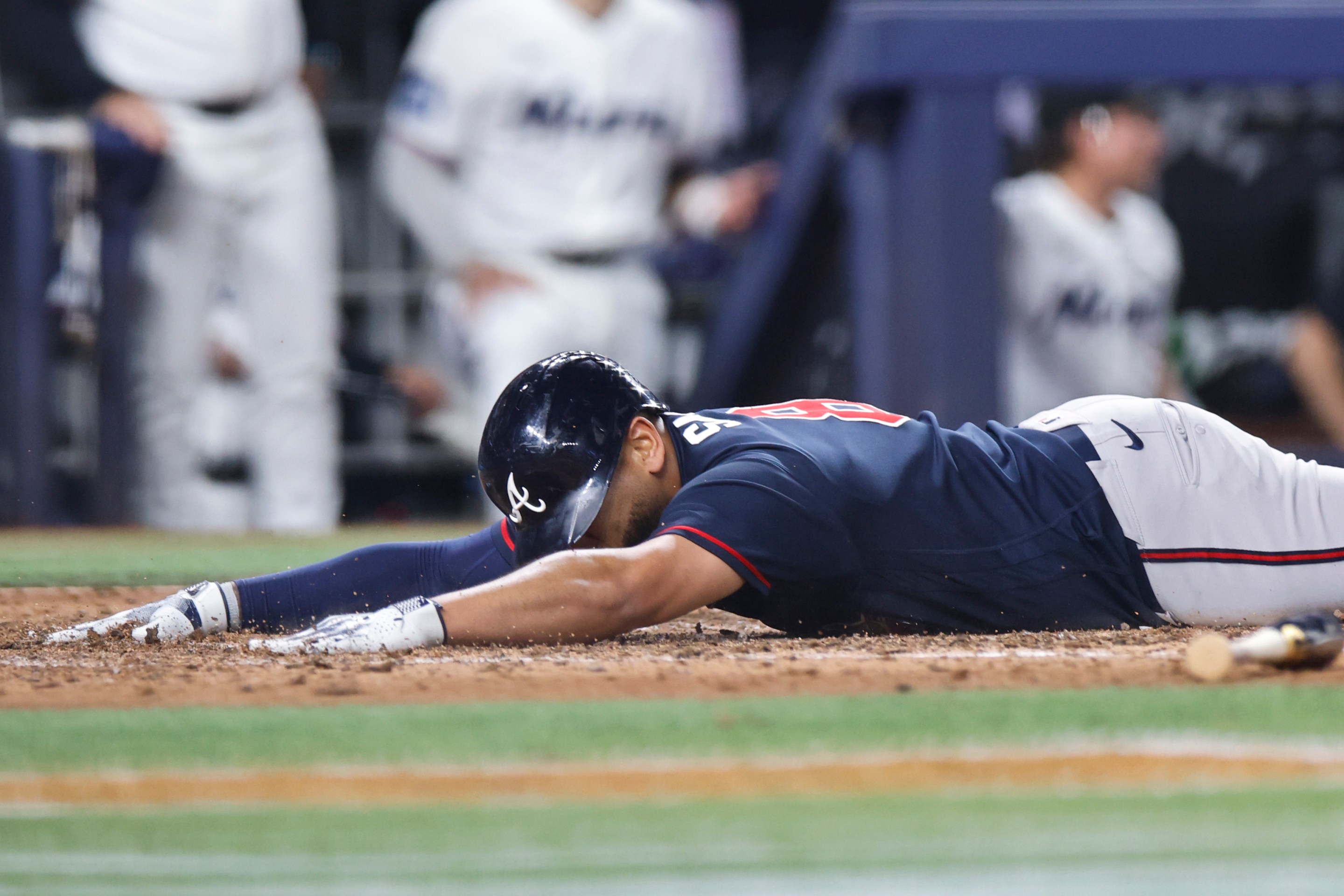 Dominic Smith of the Atlanta Braves scores after a throwing error by Owen Caissie.