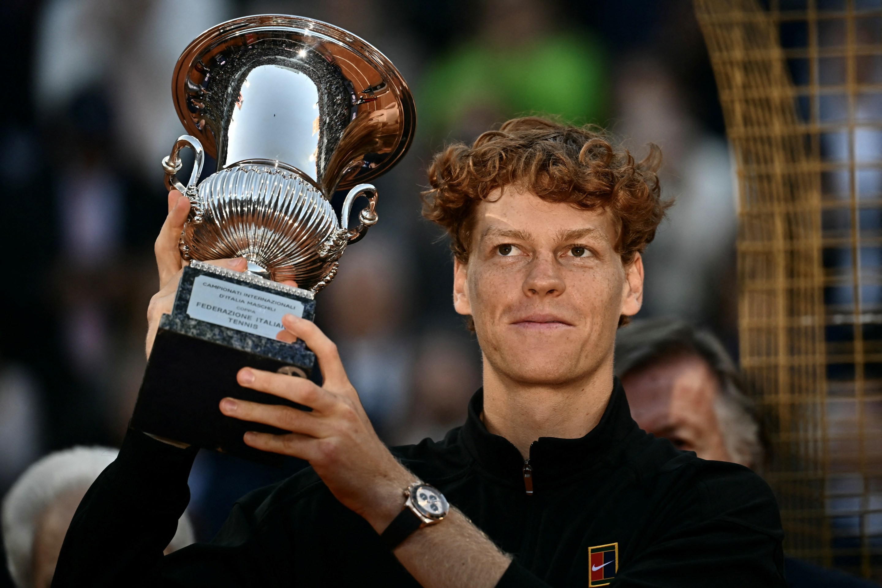 Italy's Jannik Sinner holds the trophy after winning the men's final of the ATP Rome Open tennis tournament.