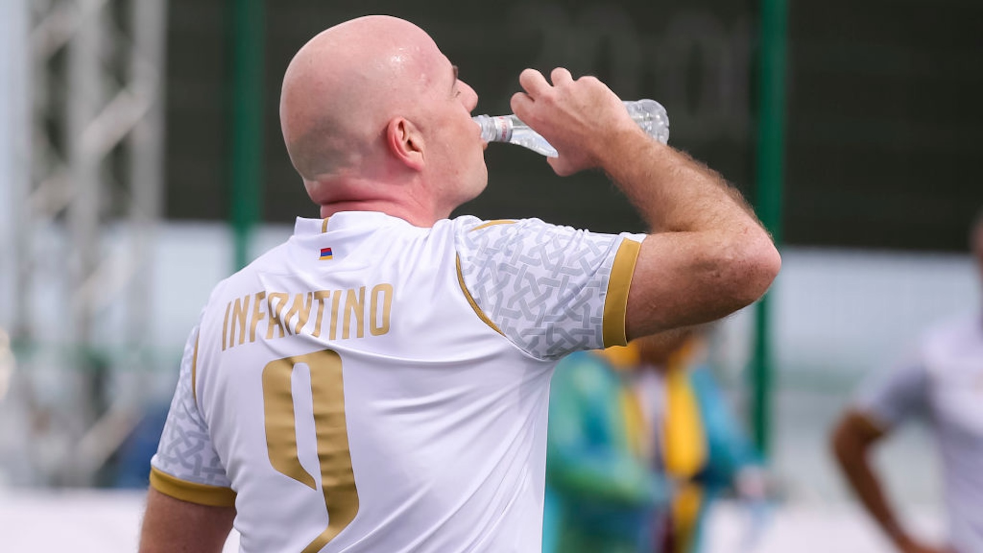 Gianni Infantino drinks some water