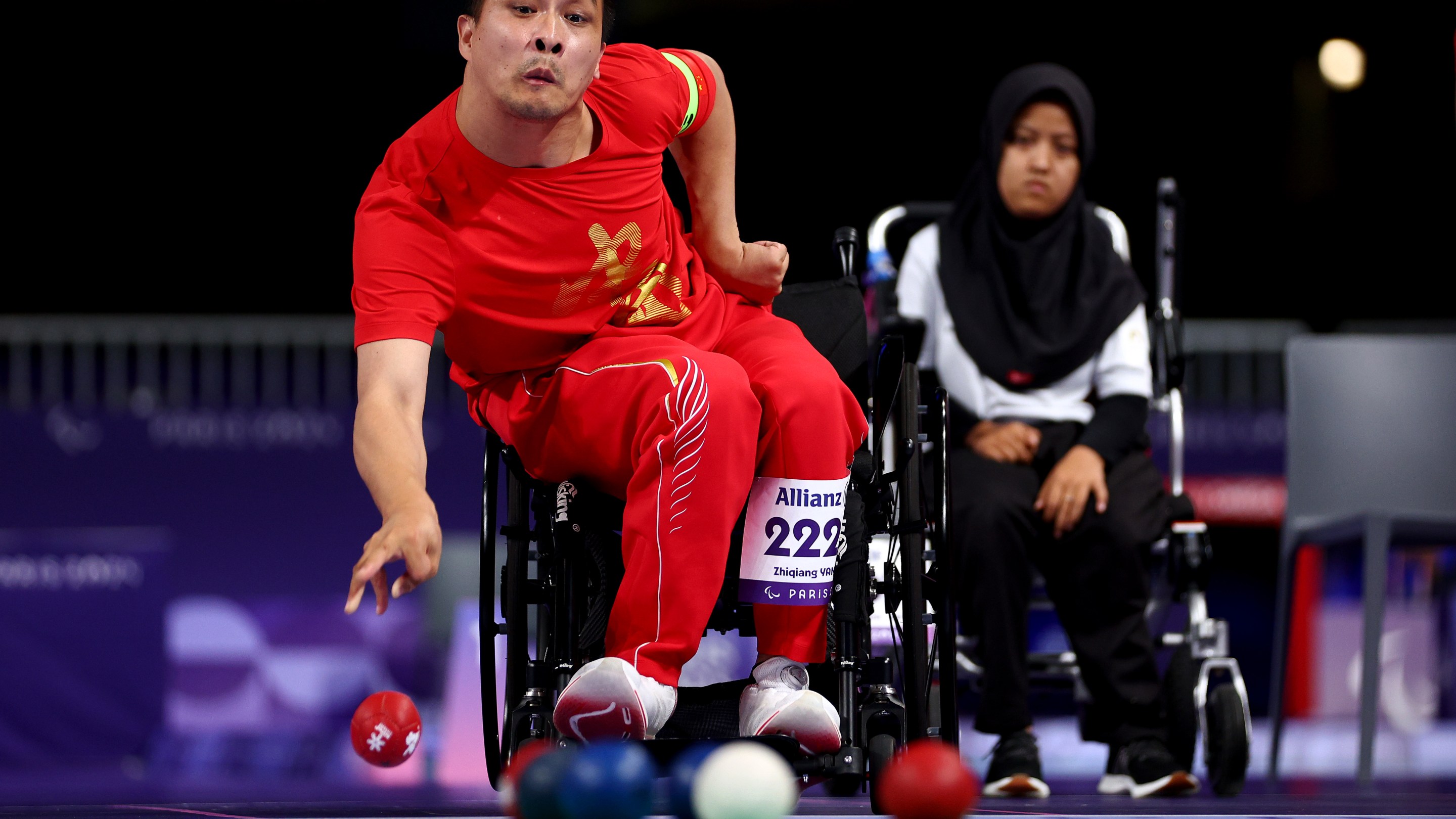 PARIS, FRANCE - SEPTEMBER 05: Zhiqiang Yan of Team People's Republic of China competes with teammates Zhijian Lan and Qi Zhang (not in frame) in the Mixed Team - BC1/BC2 Gold Medal Match #294 against Muhamad Syafa, Felix Ardi Yudha and Gischa Zayana of Team Indonesia on day eight of the Paris 2024 Summer Paralympic Games at South Paris Arena on September 05, 2024 in Paris, France. (Photo by Dean Mouhtaropoulos/Getty Images)