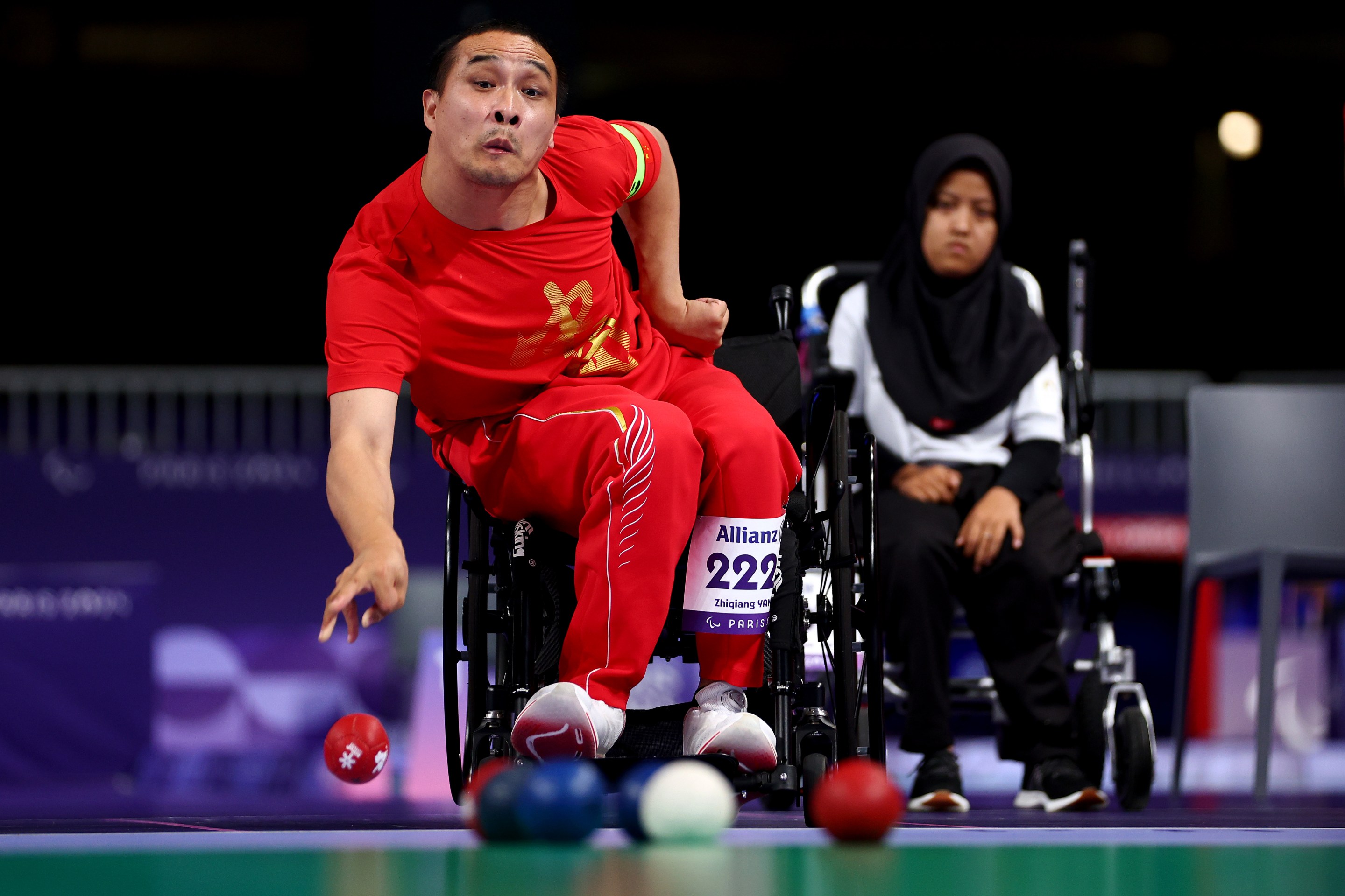 PARIS, FRANCE - SEPTEMBER 05: Zhiqiang Yan of Team People's Republic of China competes with teammates Zhijian Lan and Qi Zhang (not in frame) in the Mixed Team - BC1/BC2 Gold Medal Match #294 against Muhamad Syafa, Felix Ardi Yudha and Gischa Zayana of Team Indonesia on day eight of the Paris 2024 Summer Paralympic Games at South Paris Arena on September 05, 2024 in Paris, France. (Photo by Dean Mouhtaropoulos/Getty Images)