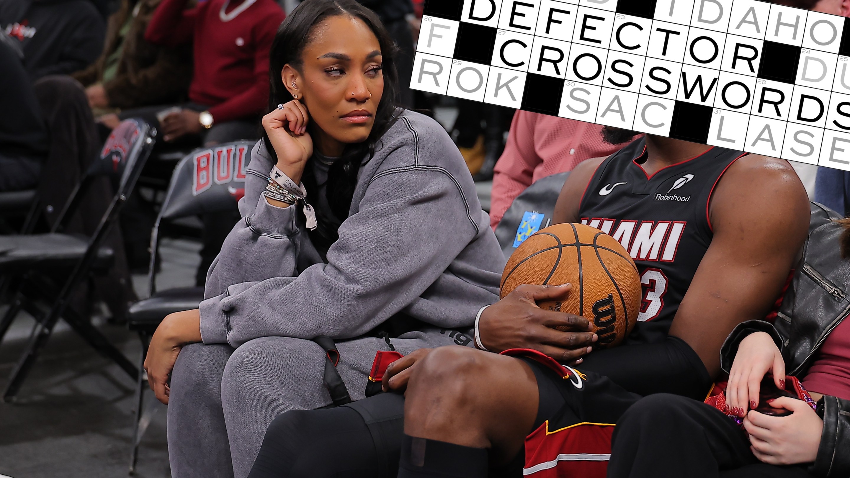 A'ja Wilson and Bam Adebayo #13 of the Miami Heat chat during a delay of a game between the Chicago Bulls and the Miami Heat game on January 8, 2026 at the United Center in Chicago, Illinois
