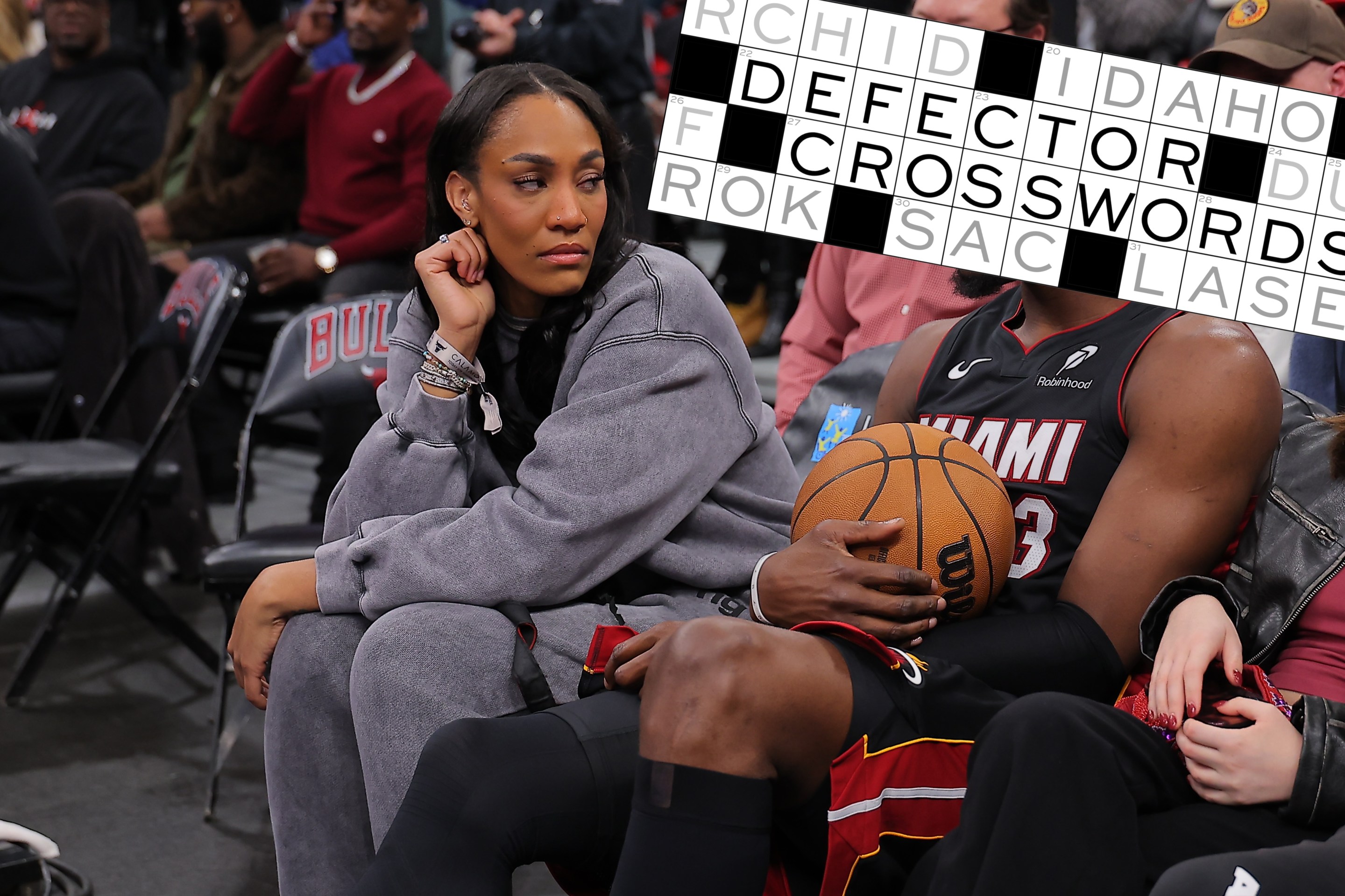 A'ja Wilson and Bam Adebayo #13 of the Miami Heat chat during a delay of a game between the Chicago Bulls and the Miami Heat game on January 8, 2026 at the United Center in Chicago, Illinois