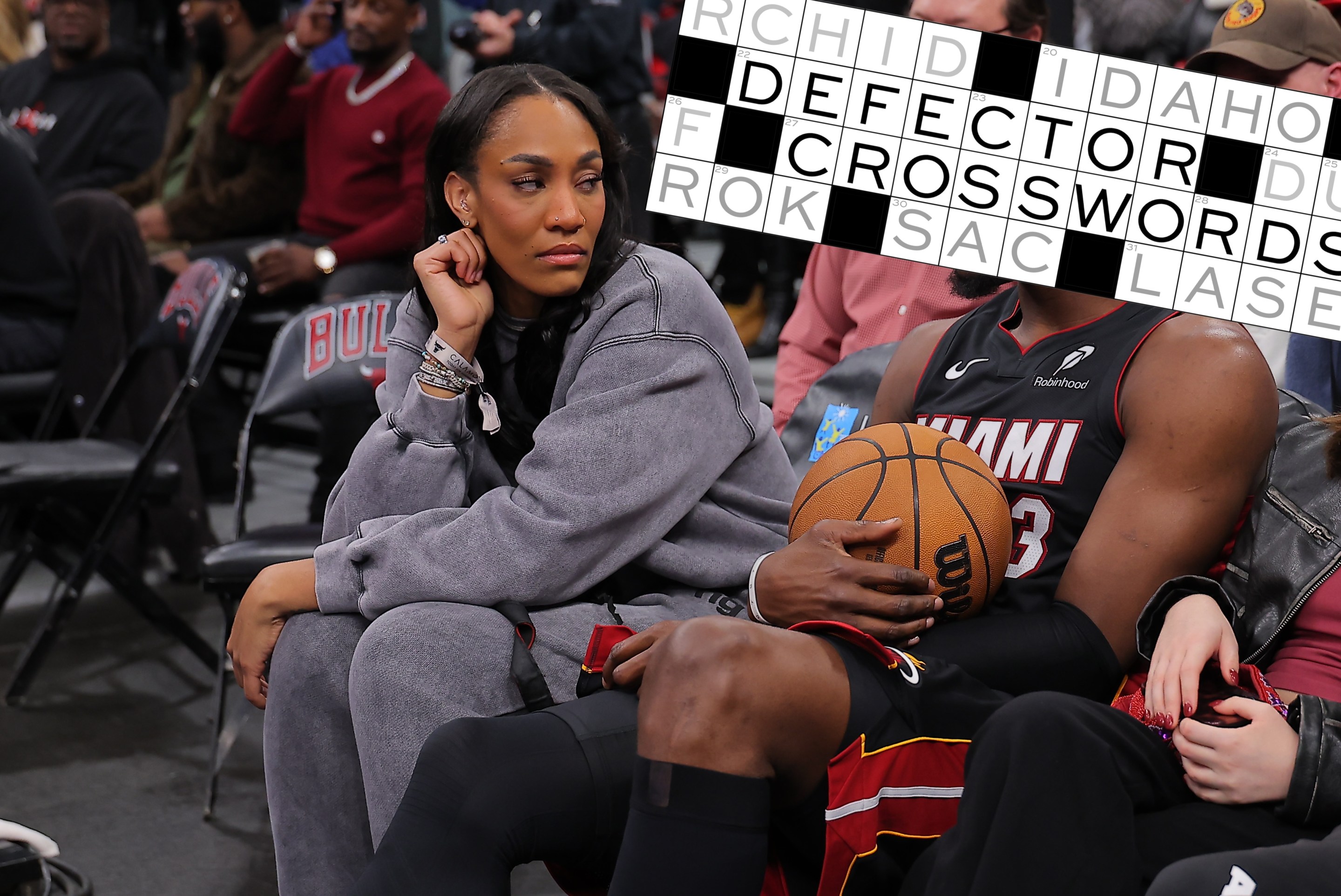 A'ja Wilson and Bam Adebayo #13 of the Miami Heat chat during a delay of a game between the Chicago Bulls and the Miami Heat game on January 8, 2026 at the United Center in Chicago, Illinois