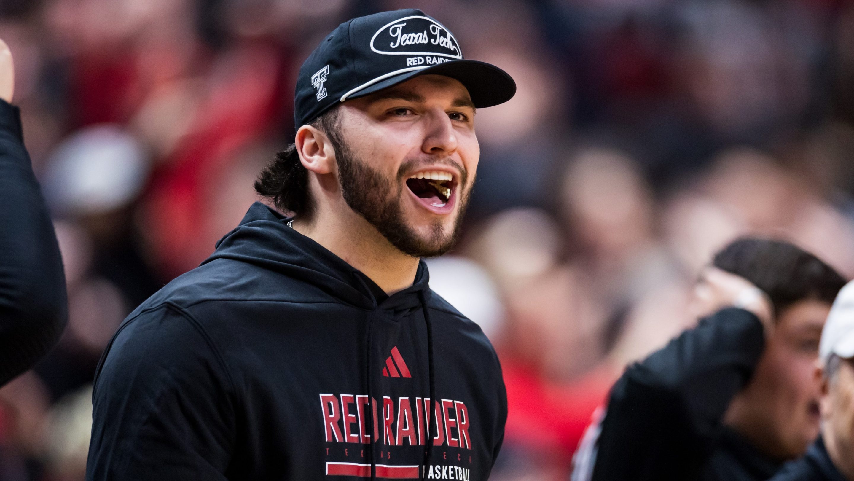 Future Texas Tech quarterback Brendan Sorsby shouts during the first half of the game between the Houston Cougars and the Texas Tech Red Raiders at United Supermarkets Arena on January 24, 2026 in Lubbock, Texas. He looks very happy.