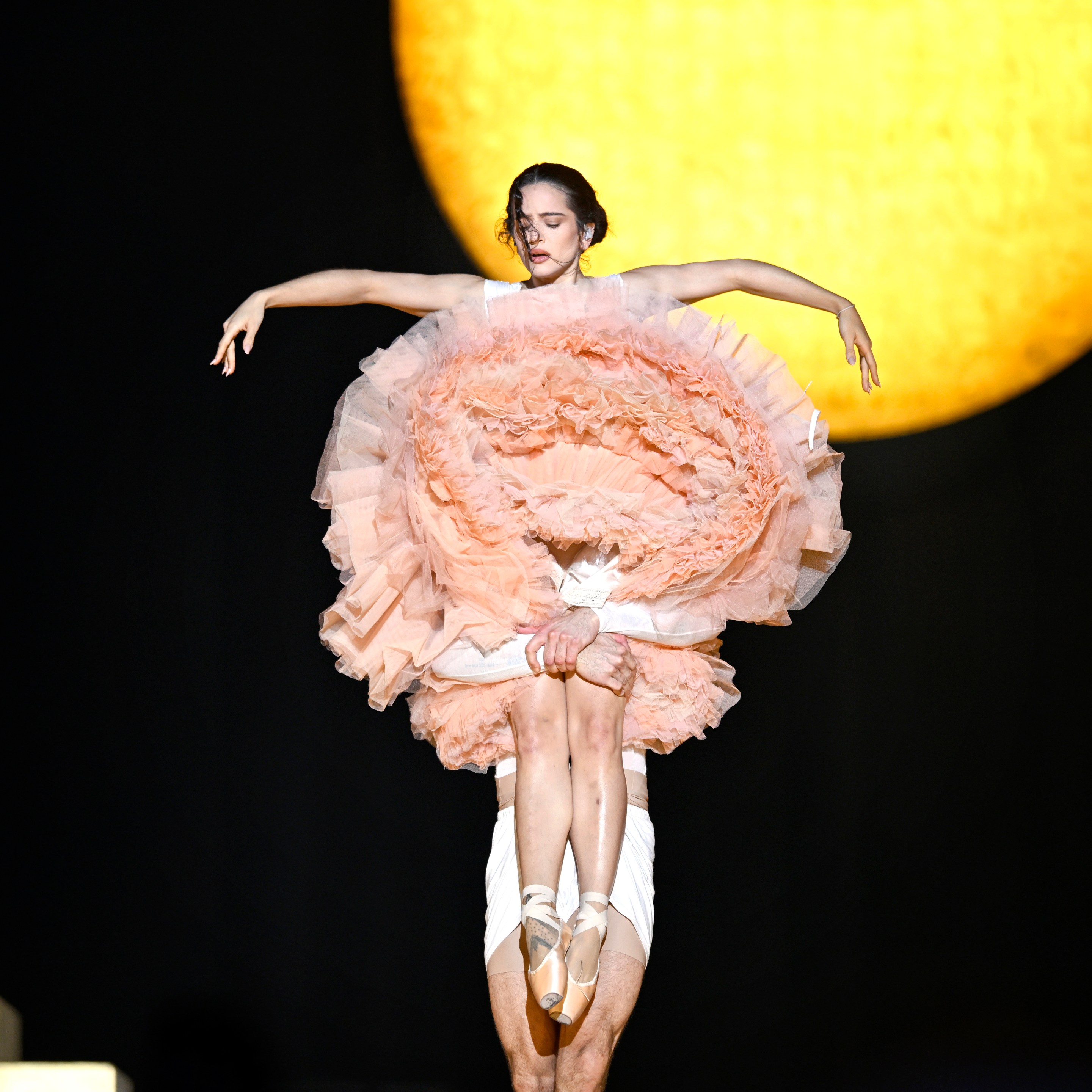 Rosalía performs on stage