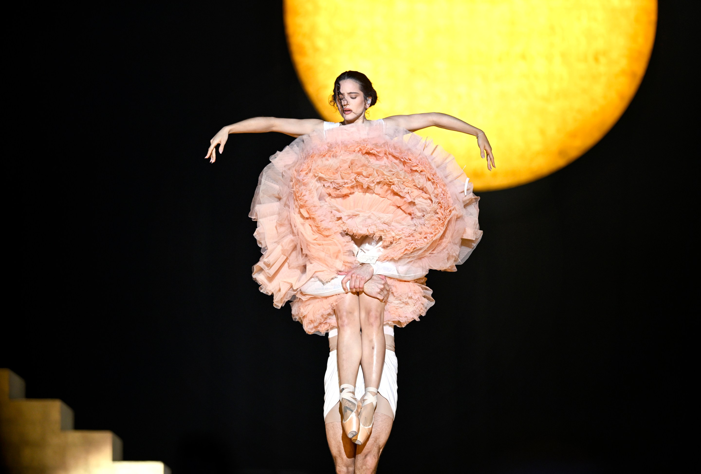 Rosalía performs on stage