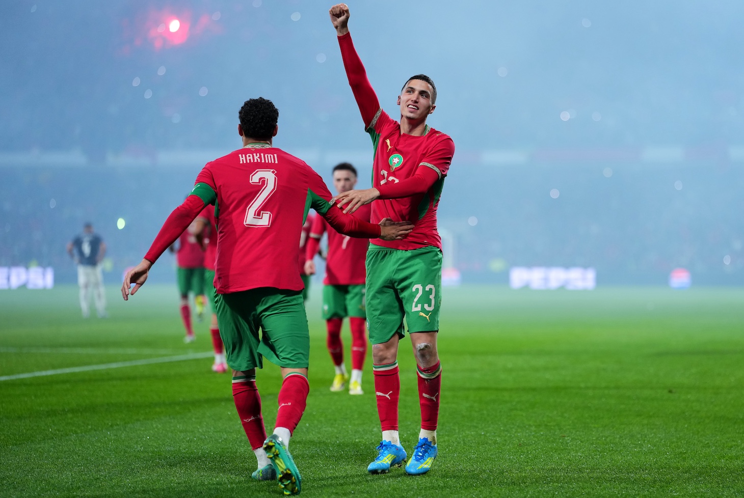 Bilal El Khannouss of Morocco celebrates scoring his team's first goal with teammate Achraf Hakimi during the international friendly match between Morocco and Paraguay.