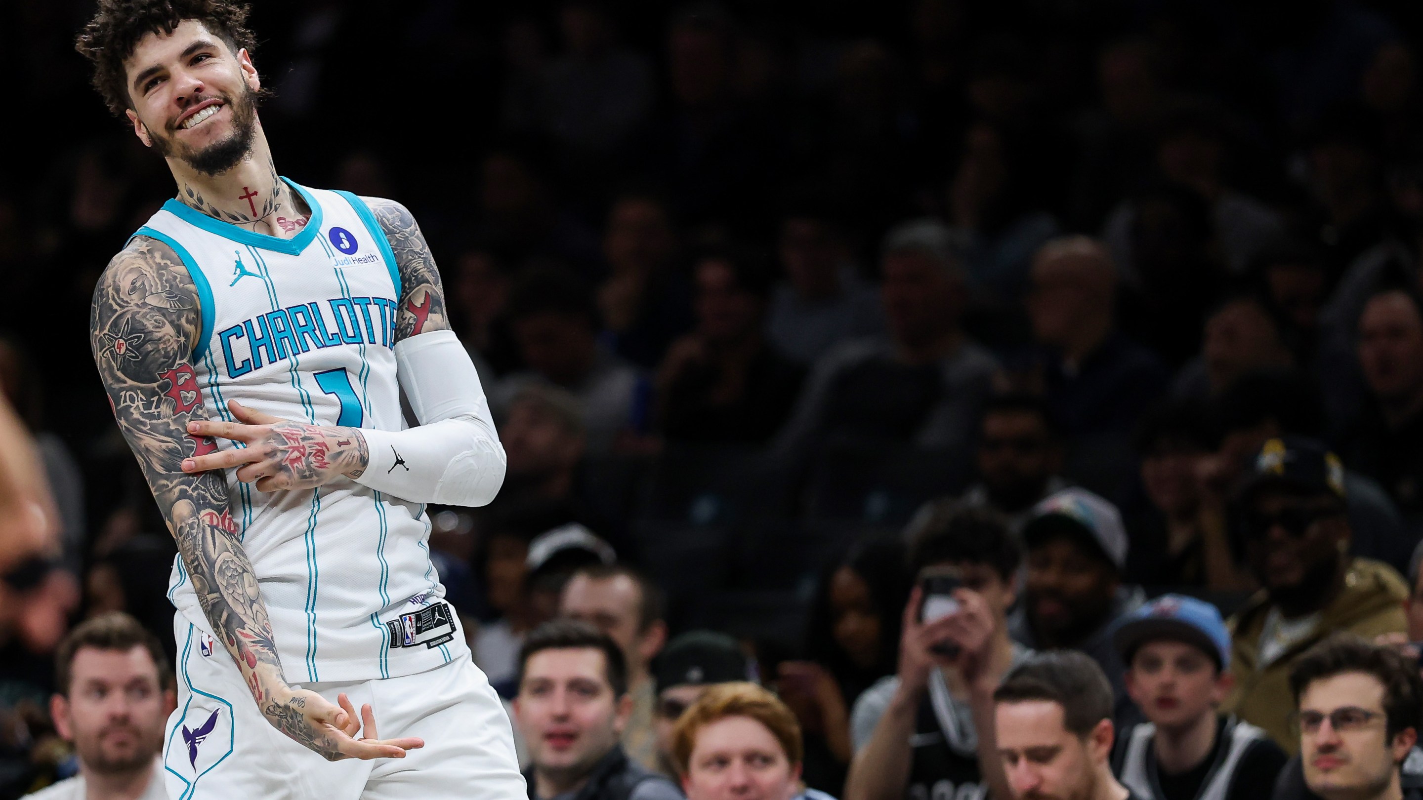 LaMelo Ball #1 of the Charlotte Hornets reacts to a three-point basket during the first quarter against the Brooklyn Nets