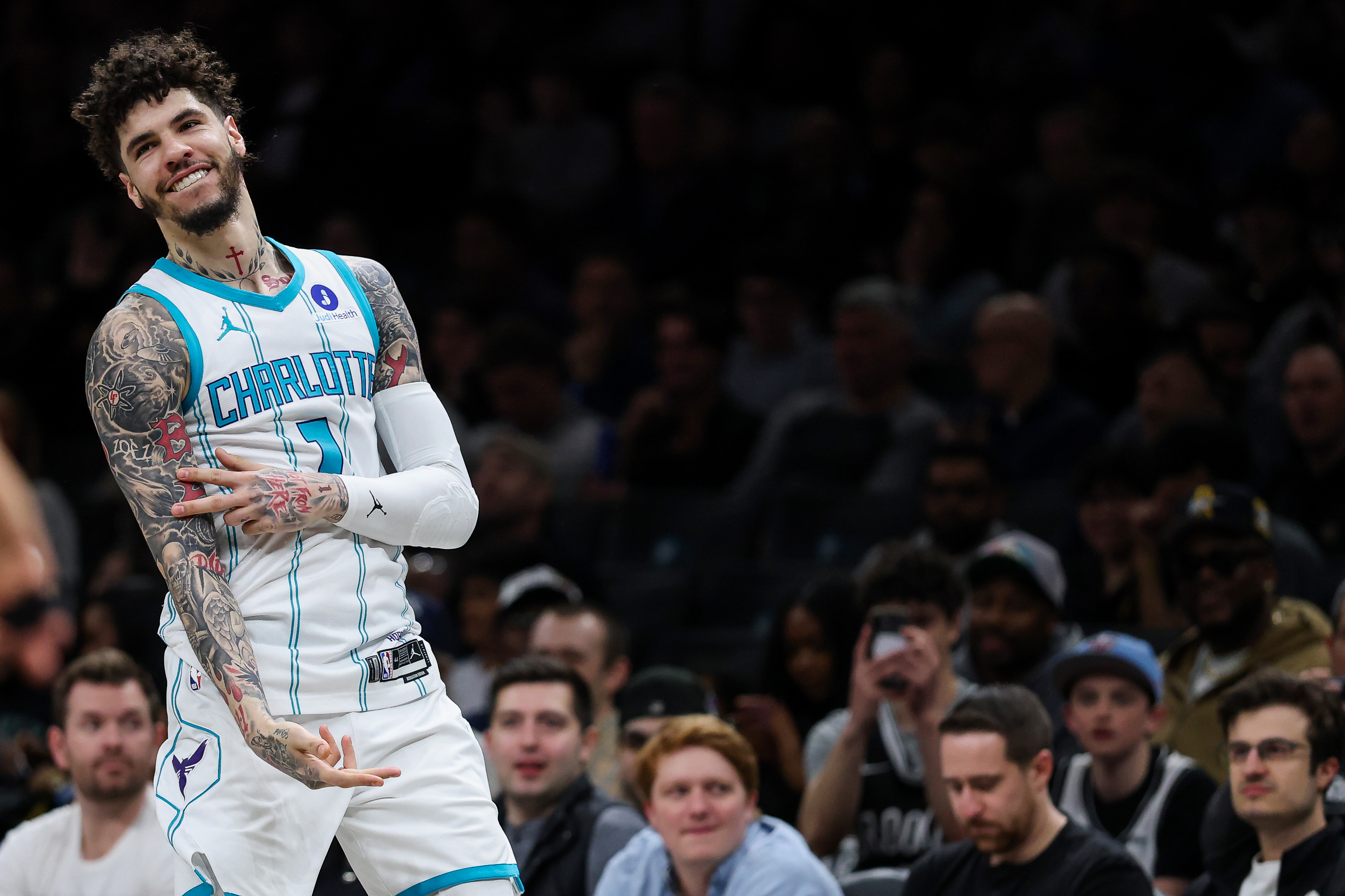 LaMelo Ball #1 of the Charlotte Hornets reacts to a three-point basket during the first quarter against the Brooklyn Nets