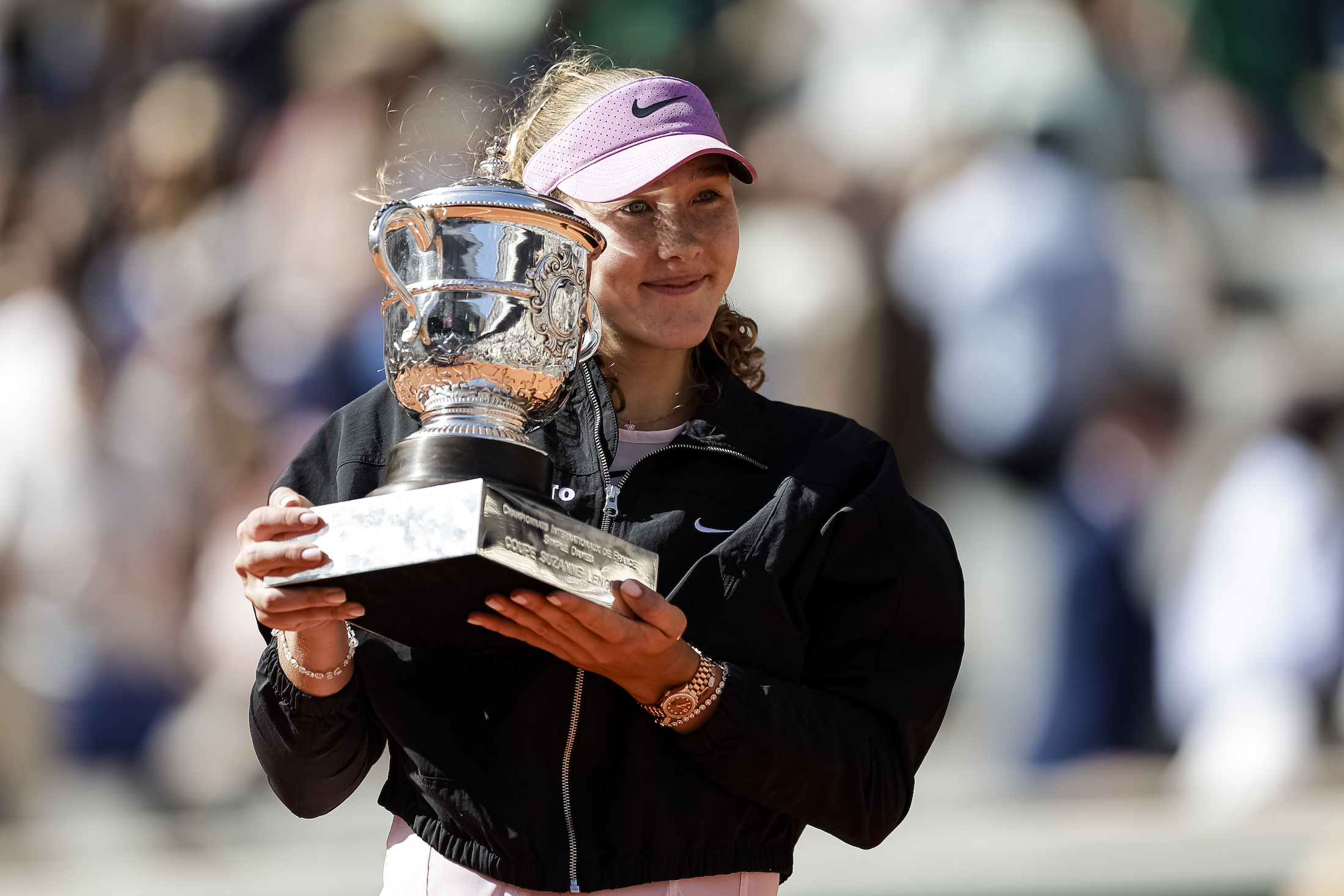 PARIS, FRANCE - JUNE 6: Mirra Andreeva celebrates with the winner's trophy after winning her match against Maja Chwalinska of Poland during the Women's Final on Day Fourteen of the 2026 French Open at Roland Garros on June 6, 2026 in Paris, France. (Photo by Antonio Borga/Eurasia Sport Images/Getty Images)