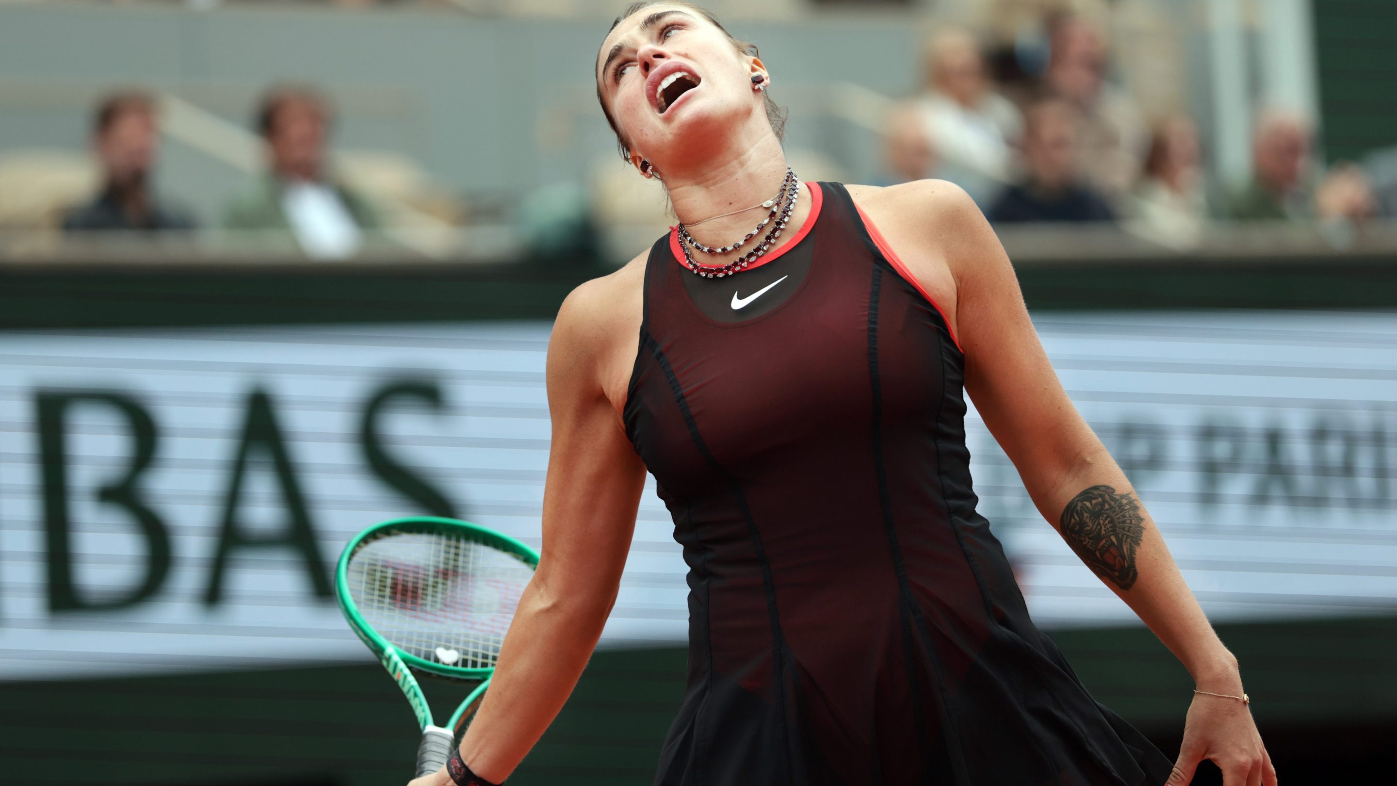 Aryna Sabalenka reacts as she is on the way to being defeated by Diana Shnaider