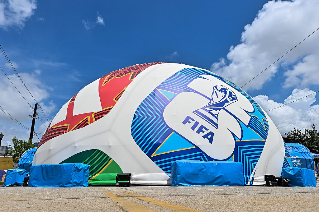 A big inflatable soccer ball fills with air at the houston world cup fan zone.
