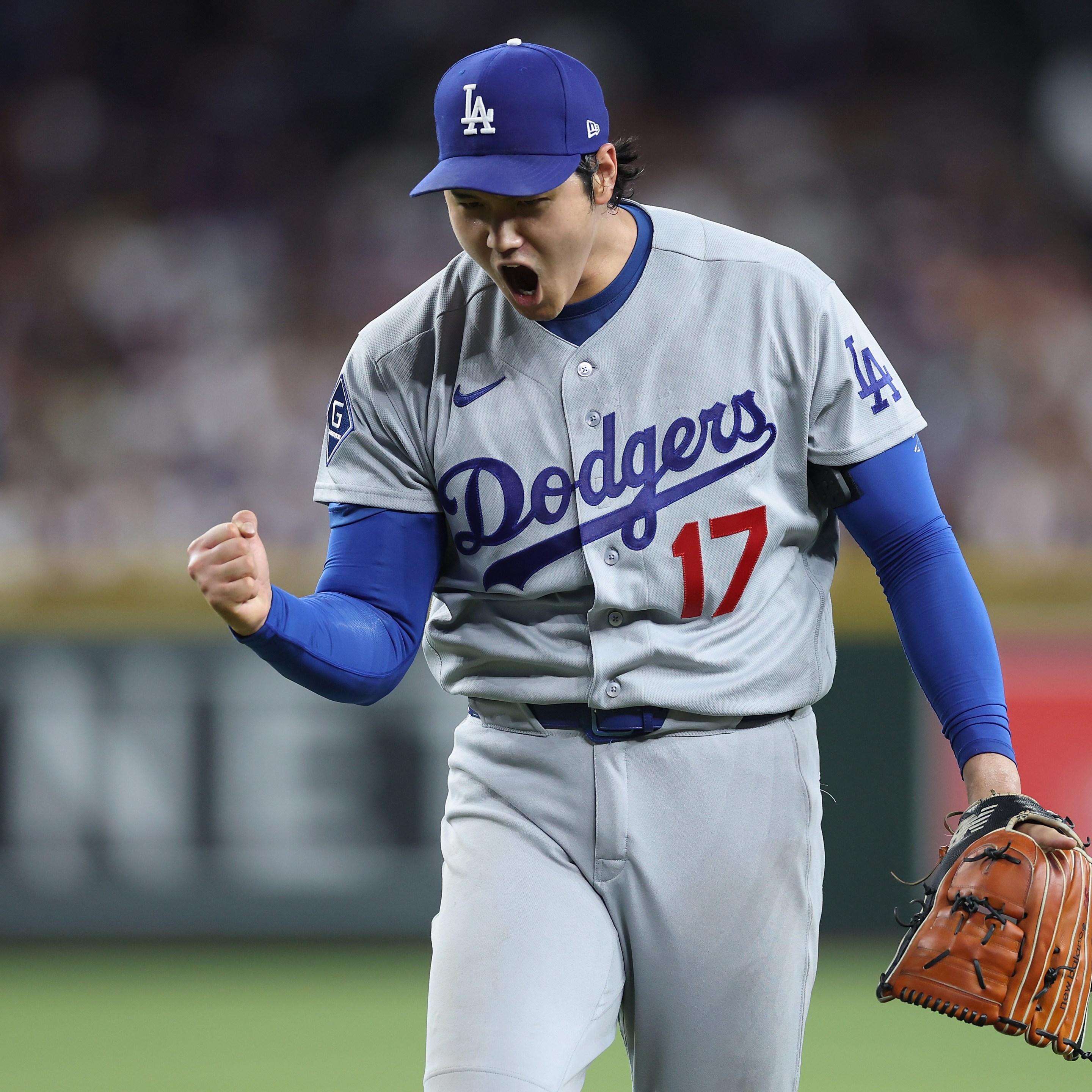 Starting pitcher Shohei Ohtani #17 of the Los Angeles Dodgers reacts after pitching out of the sixth inning