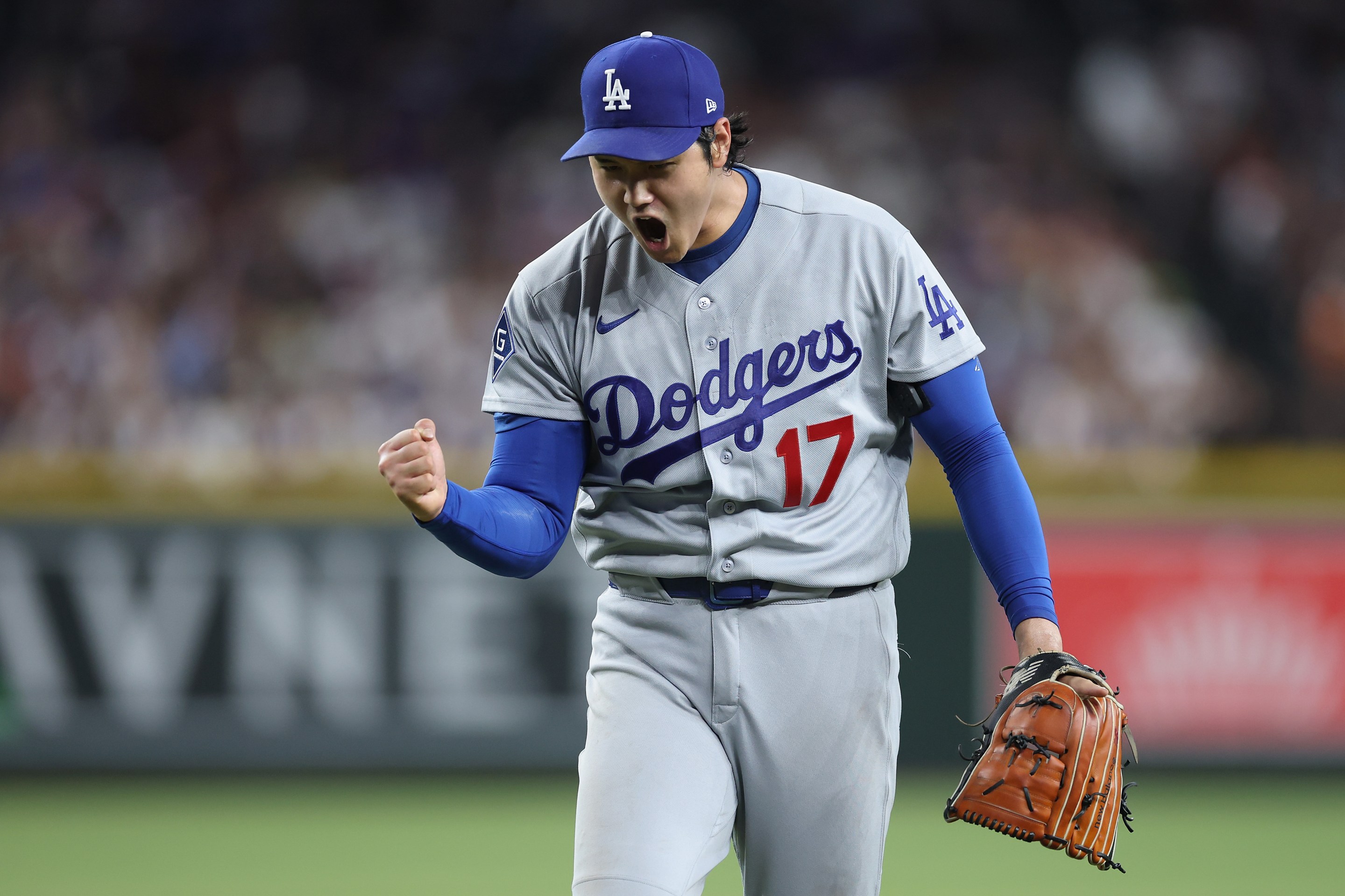 Starting pitcher Shohei Ohtani #17 of the Los Angeles Dodgers reacts after pitching out of the sixth inning