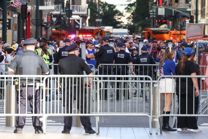 People wait to enter Madison Square Garden ahead of the NBA Finals game 3