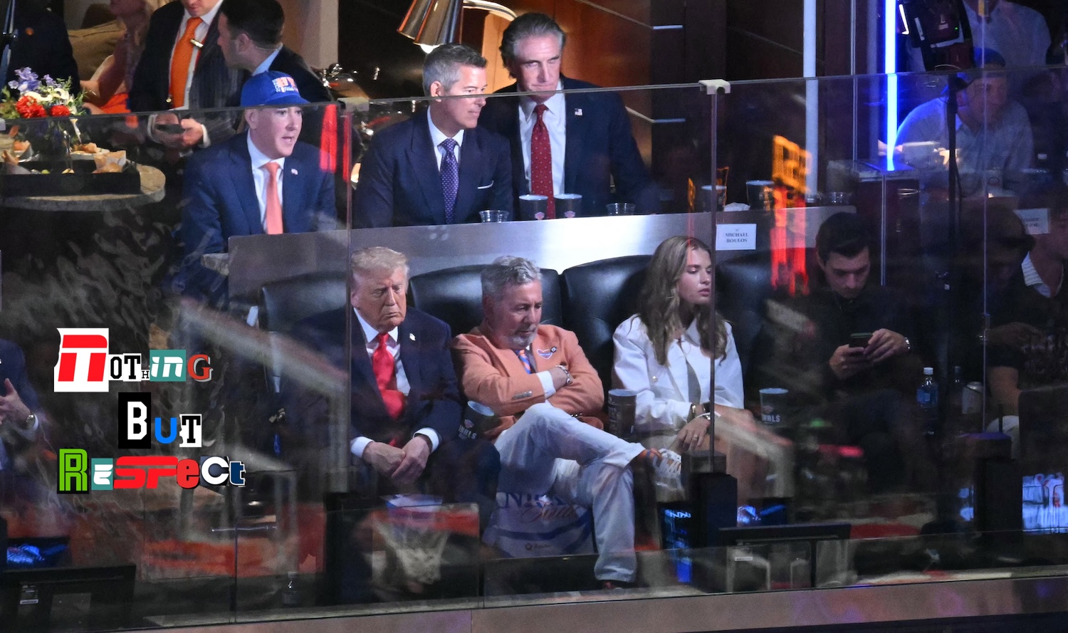 US President Donald Trump sits next to Knicks owner James Dolan as they attend Game Three of the NBA Finals between the San Antonio Spurs and the New York Knicks at Madison Square Garden in New York on June 8, 2026. (Photo by SAUL LOEB / AFP)