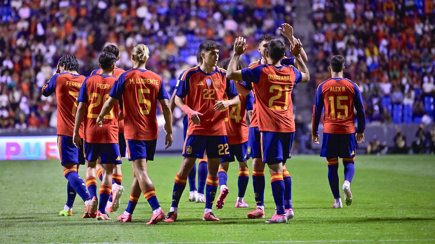 Mikel Oyarzabal of Spain celebrates with teammates after scoring the first goal of his team during the international friendly match between Peru and Spain at Estadio Cuauhtémoc in Puebla, Mexico.