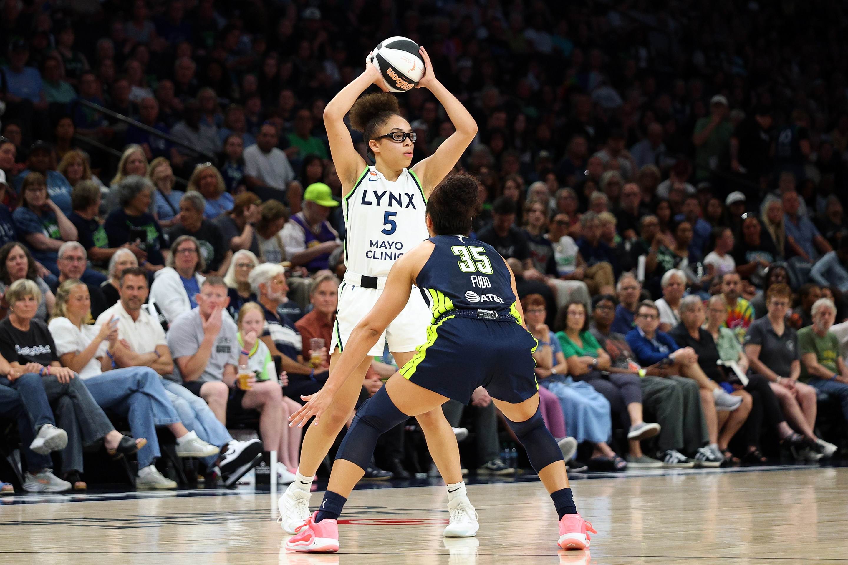 Olivia Miles #5 of the Minnesota Lynx handles the ball against Azzi Fudd #35 of the Dallas Wings in the third quarter at Target Center on June 09, 2026 in Minneapolis, Minnesota. The Lynx defeated the Wings 100-76.