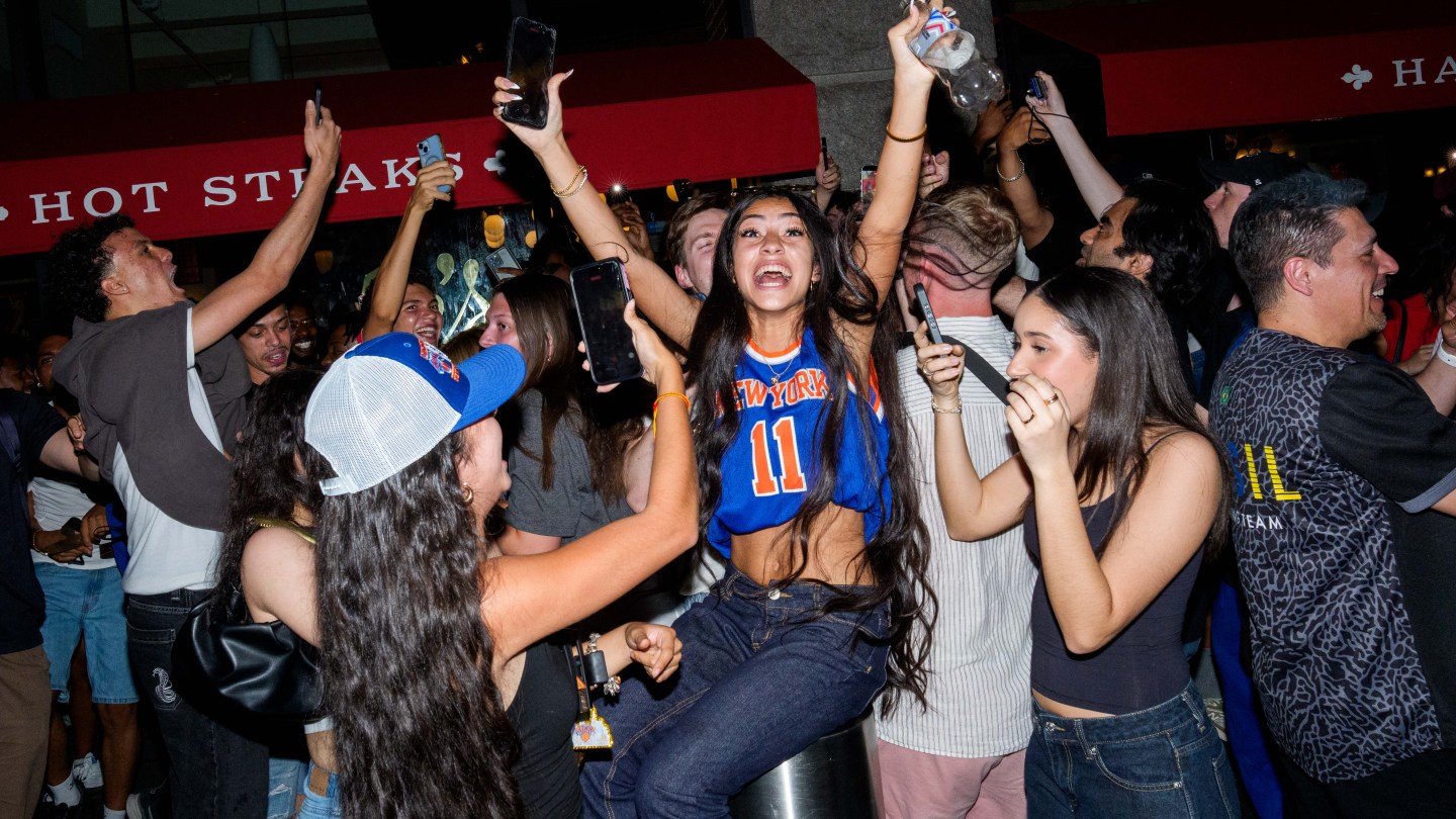 NEW YORK, NEW YORK - JUNE 13: New York Knicks fans celebrate as they win against San Antonio Spurs in Game 5 of the NBA Finals on June 13, 2026 in New York City. The New York Knicks lead the San Antonio Spurs 3-1 and could win the franchise's first NBA championship since 1973 if they win tonight.(Photo by Adam Gray/Getty Images)