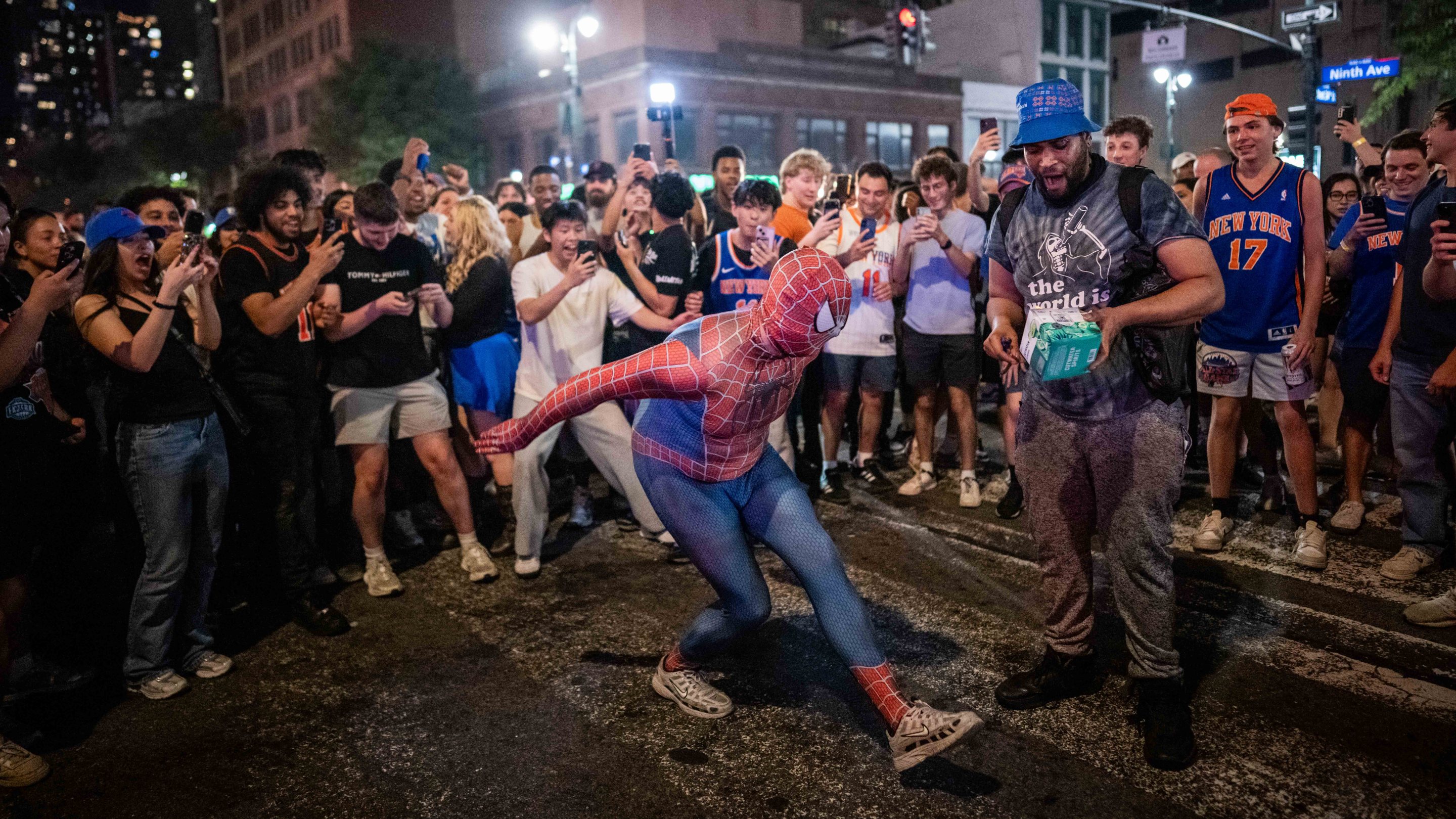 NEW YORK, NEW YORK - JUNE 14: A person dressed as Spiderman dances as New York Knicks fans celebrate their win against San Antonio Spurs in Game 5 of the NBA Finals on June 14, 2026 in New York City. The New York Knicks lead the San Antonio Spurs 3-1 and could win the franchise's first NBA championship since 1973 if they win tonight.(Photo by Adam Gray/Getty Images)