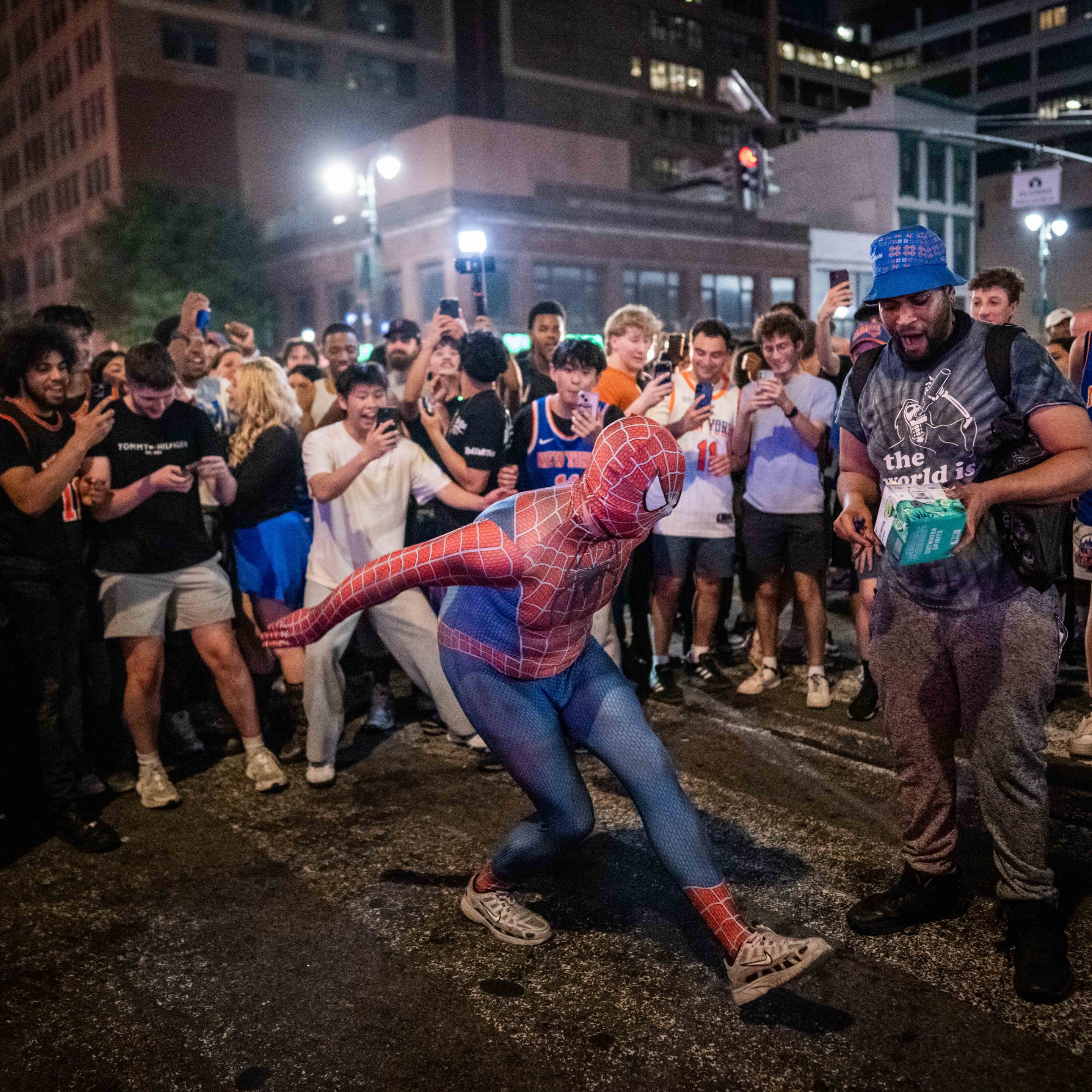 NEW YORK, NEW YORK - JUNE 14: A person dressed as Spiderman dances as New York Knicks fans celebrate their win against San Antonio Spurs in Game 5 of the NBA Finals on June 14, 2026 in New York City. The New York Knicks lead the San Antonio Spurs 3-1 and could win the franchise's first NBA championship since 1973 if they win tonight.(Photo by Adam Gray/Getty Images)