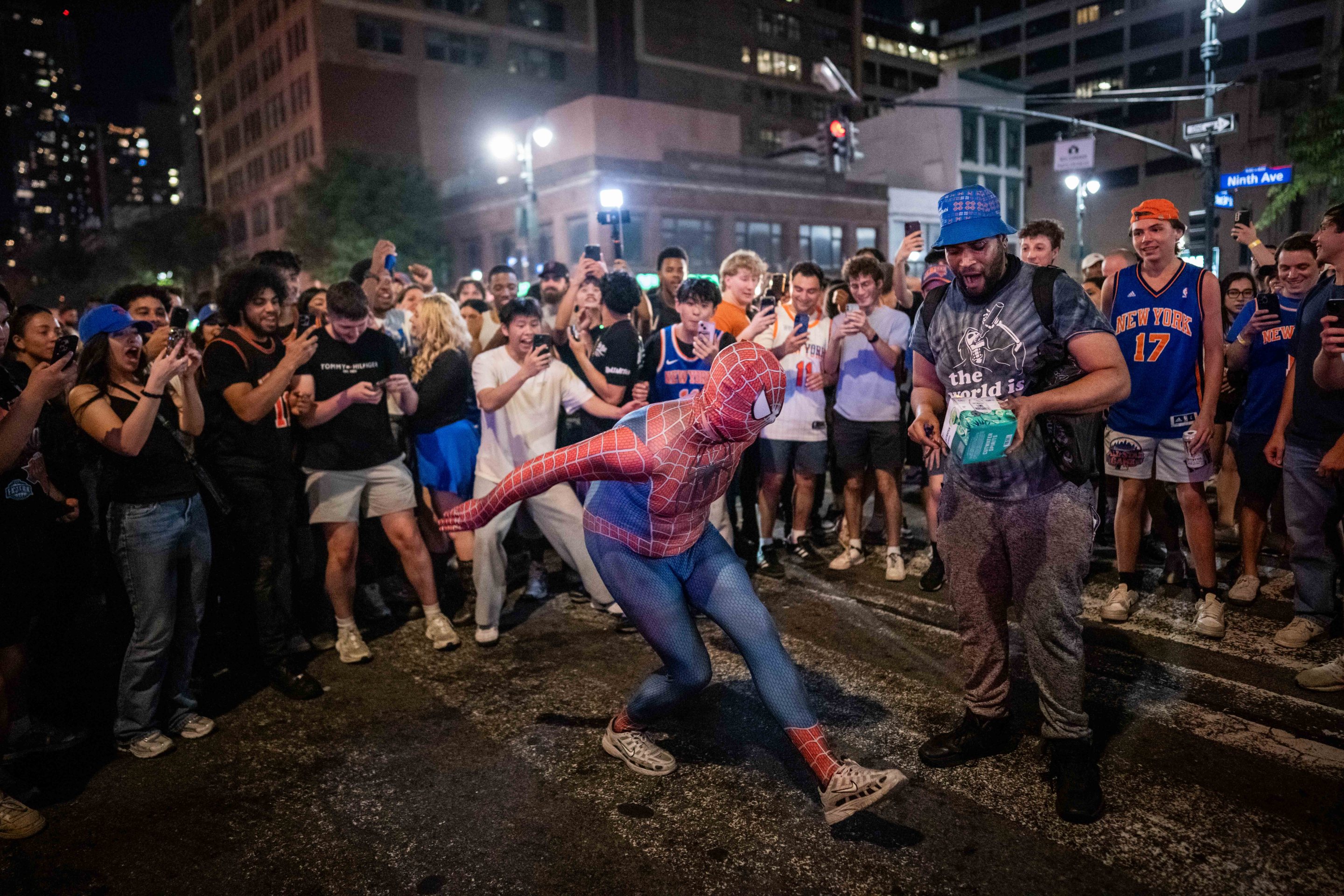 NEW YORK, NEW YORK - JUNE 14: A person dressed as Spiderman dances as New York Knicks fans celebrate their win against San Antonio Spurs in Game 5 of the NBA Finals on June 14, 2026 in New York City. The New York Knicks lead the San Antonio Spurs 3-1 and could win the franchise's first NBA championship since 1973 if they win tonight.(Photo by Adam Gray/Getty Images)