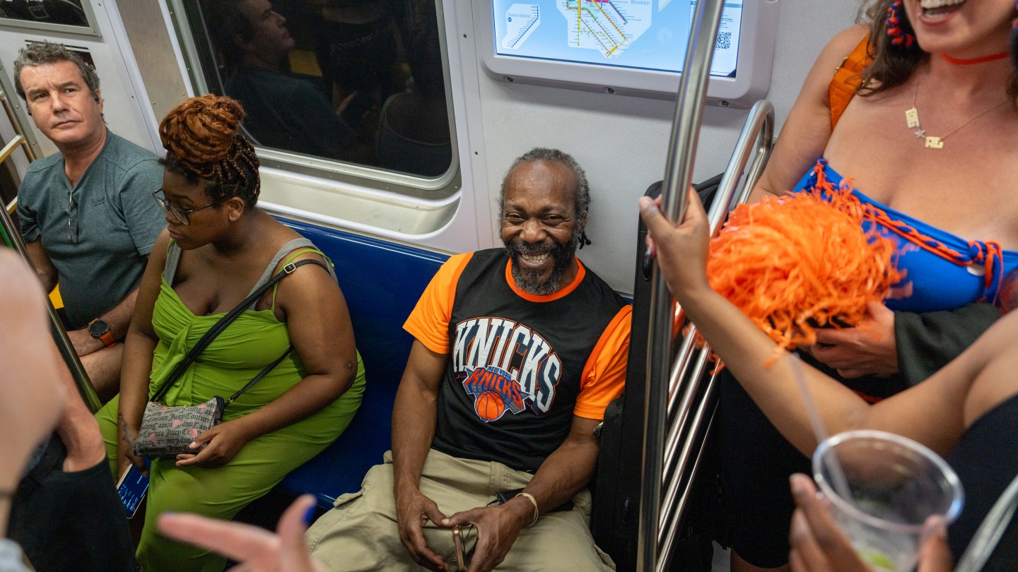 NEW YORK, NEW YORK - JUNE 13: New Yorkers celebrate on an A subway train after the Knicks win Game 5 of the NBA finals to secure the championship on June 13, 2026 in New York City. The Knicks closed out the San Antonio Spurs to win their first title since 1973. (Photo by Jeremy Weine/Getty Images)