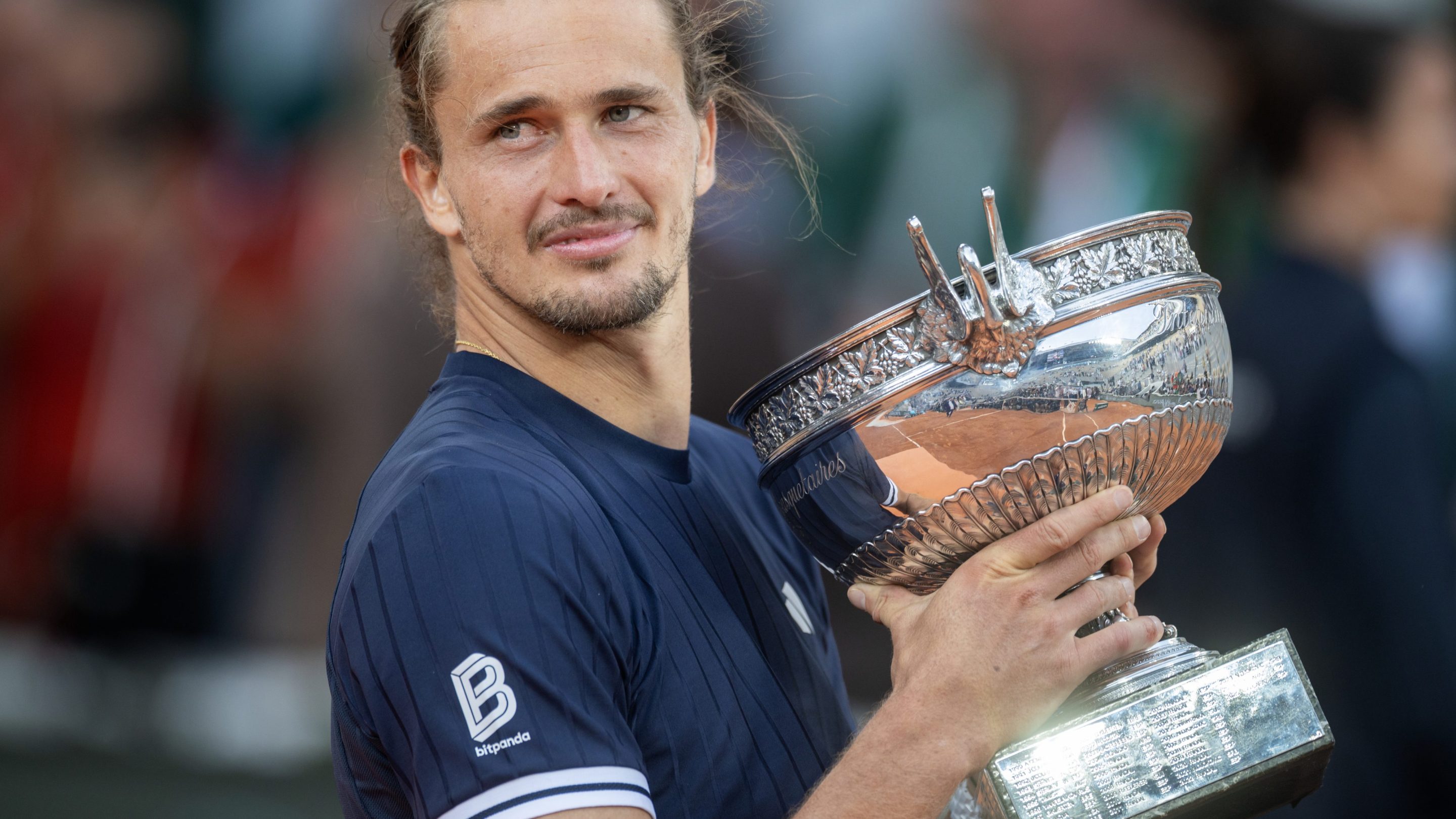 Alexander Zverev with the winners' trophy after his victory against Flavio Cobolli