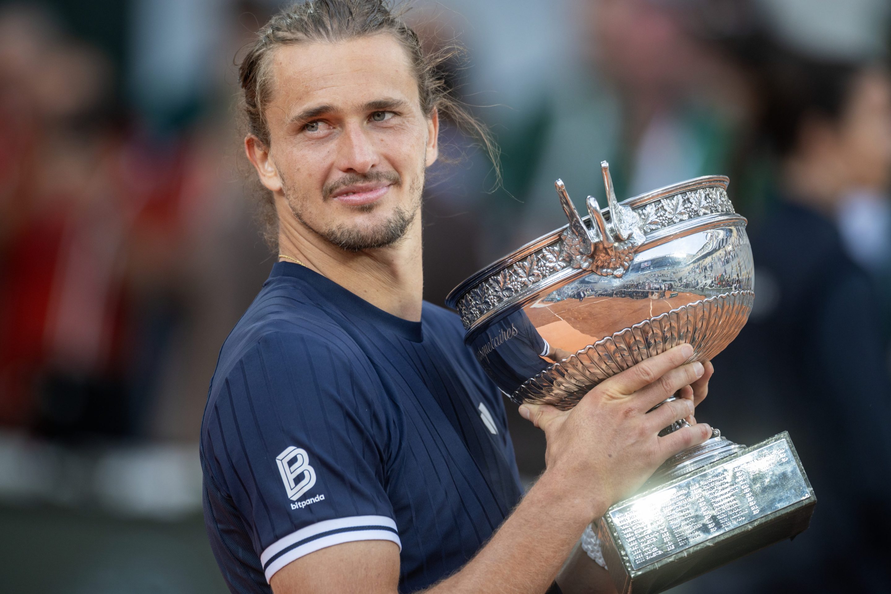 Alexander Zverev with the winners' trophy after his victory against Flavio Cobolli