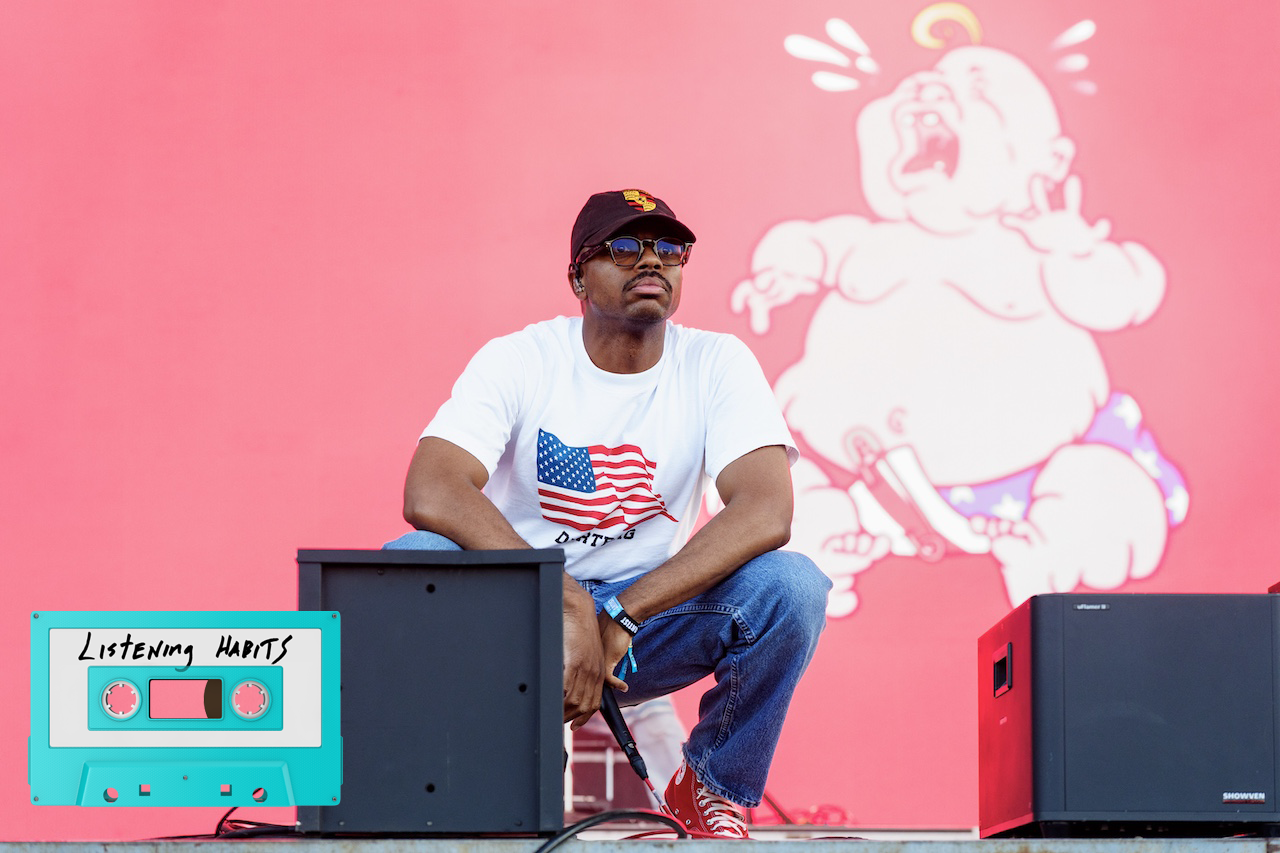Vince Staples crouching on stage.