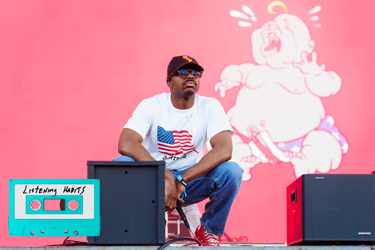 Vince Staples crouching on stage.