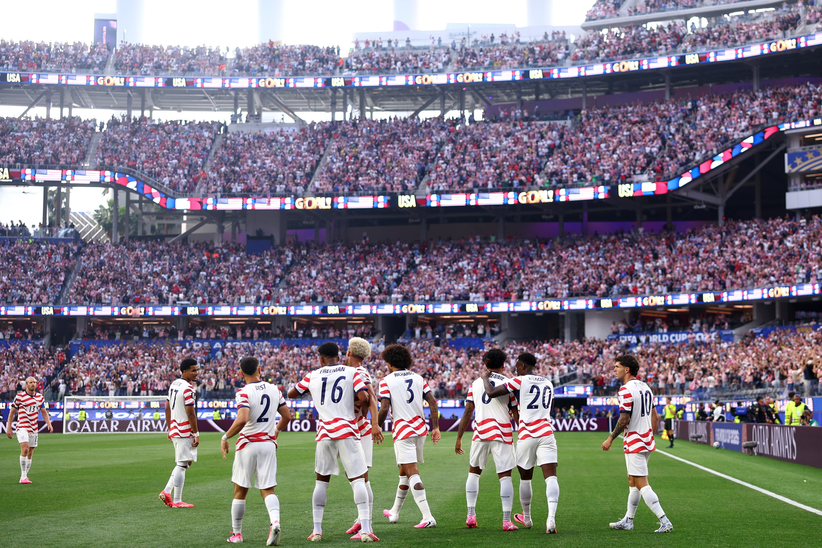 LOS ANGELES, CALIFORNIA - JUNE 12: layers of the United States celebrate their side's first goal, an own goal by Damian Bobadilla #16 of Paraguay (not pictured), during the FIFA World Cup 2026 Group D match between USA and Paraguay at Los Angeles Stadium on June 12, 2026 in Los Angeles, California. (Photo by Dean Mouhtaropoulos/Getty Images)