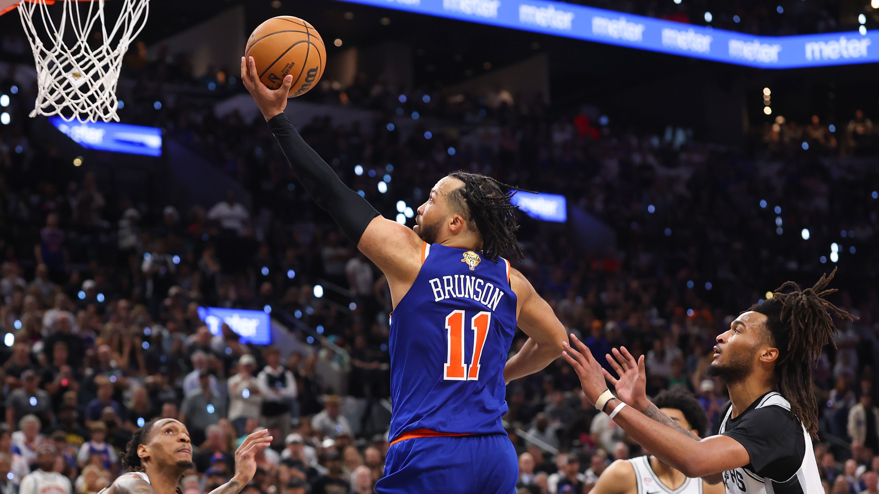 SAN ANTONIO, TEXAS - JUNE 13: Jalen Brunson #11 of the New York Knicks shoots the ball past Stephon Castle #5 of the San Antonio Spurs during the fourth quarter in Game Five of the 2026 NBA Finals at Frost Bank Center on June 13, 2026 in San Antonio, Texas. NOTE TO USER: User expressly acknowledges and agrees that, by downloading and or using this photograph, User is consenting to the terms and conditions of the Getty Images License Agreement. (Photo by Gregory Shamus/Getty Images)